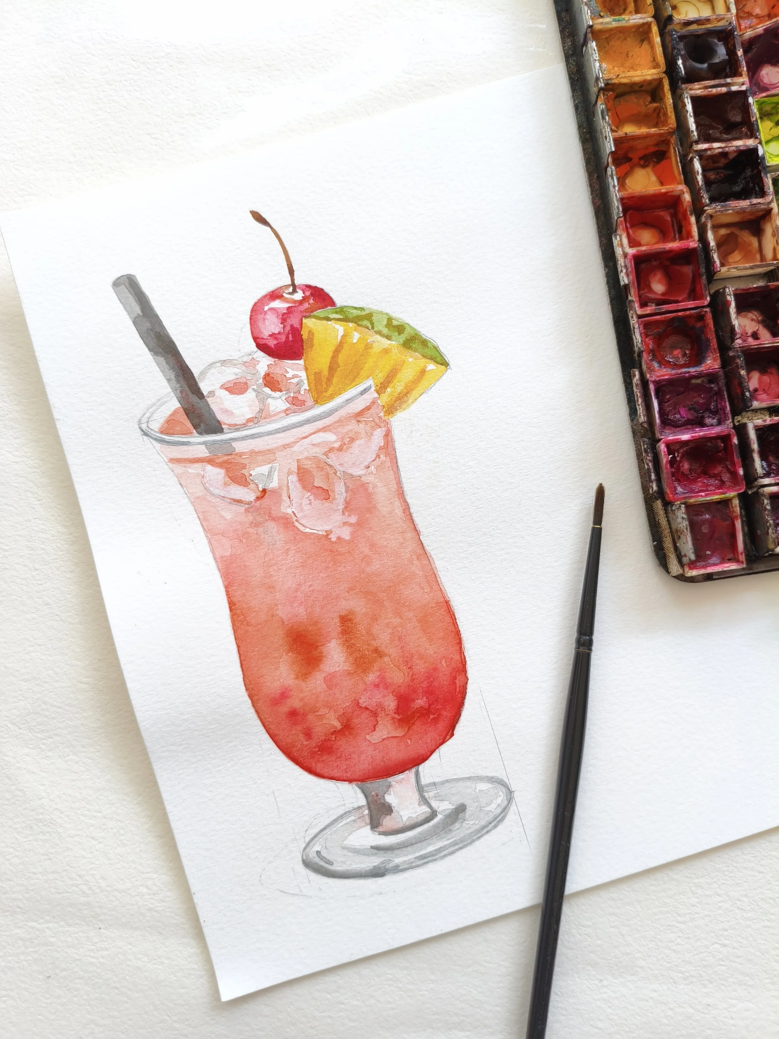 Pintura acuarela de un refresco en copa con hielo, decorado con una cereza y una rodaja de naranja, acompañado de un popote.