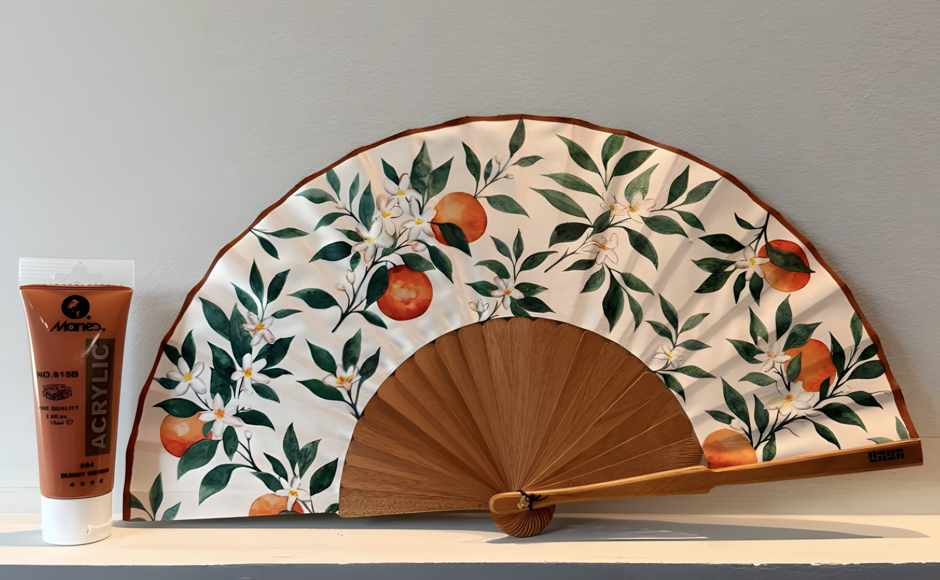 Hand-painted edge finish for bespoke luxury hand fans created for hotels and hospitality. The colour can be developed specifically to complement the visual palette and creative concept of each destination.