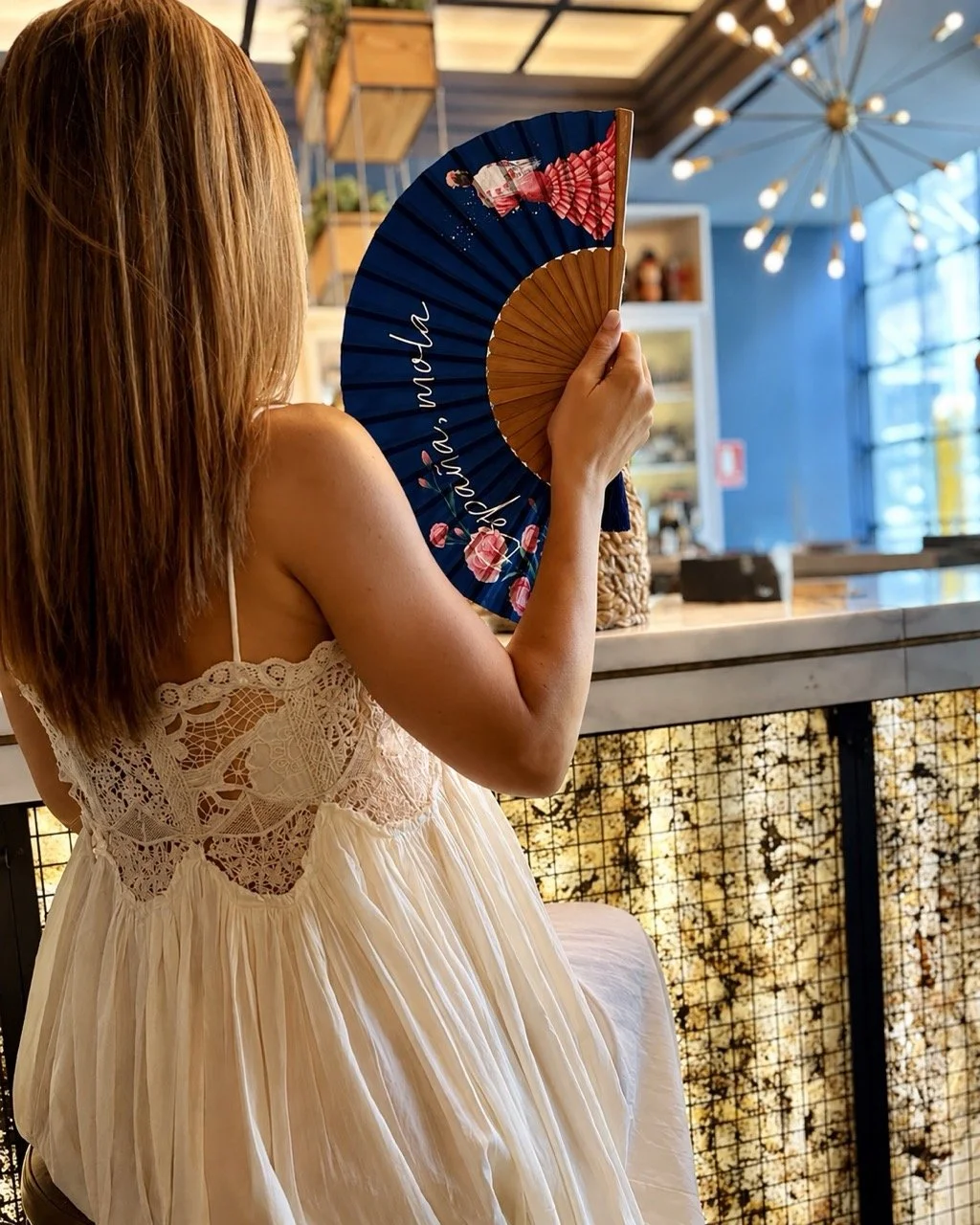 Bespoke hand fan by Island Whisper Atelier with custom artwork and natural wood, designed for restaurants, hospitality brands and special events.