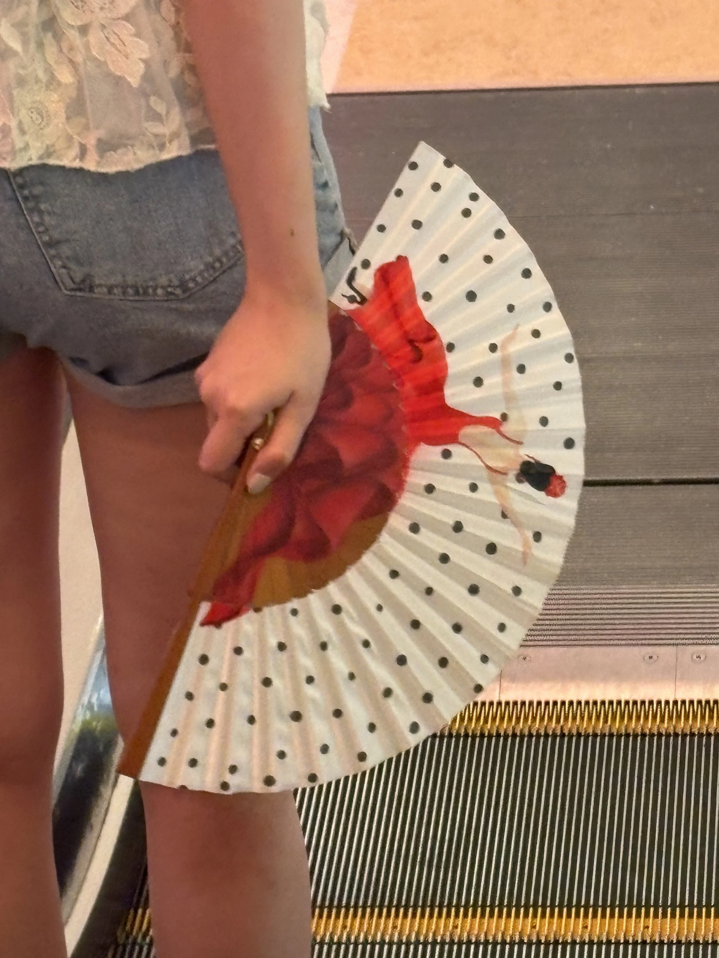 The movement and colour of flamenco captured in a signature hand fan by Island Whisper Atelier. A red flamenco dress, black polka dots and natural wood celebrate the expressive spirit of Spain.