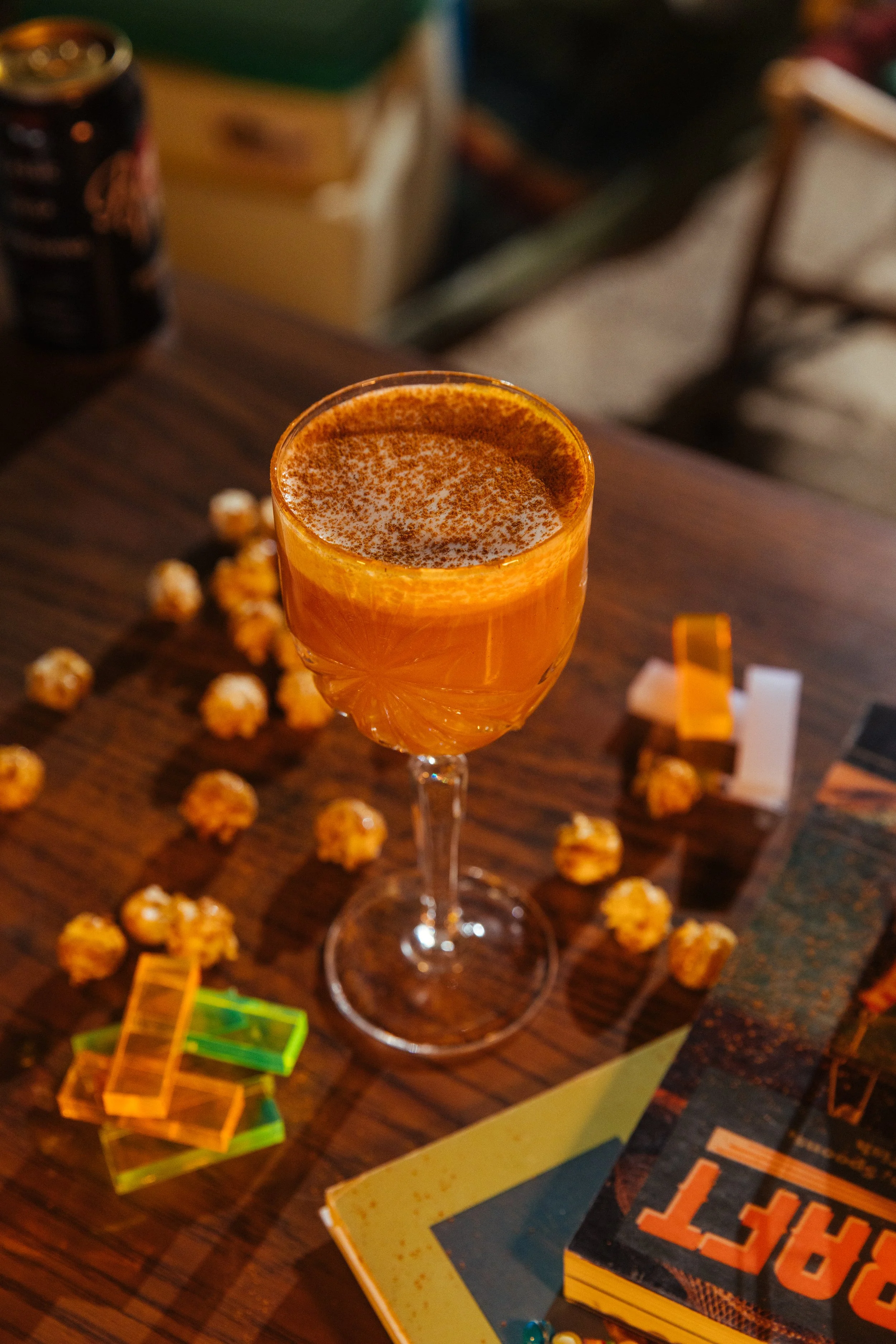 Scout — Vodka, carrot, cinnamon, ginger and lemon topped with walnut cream and ground cinnamon.