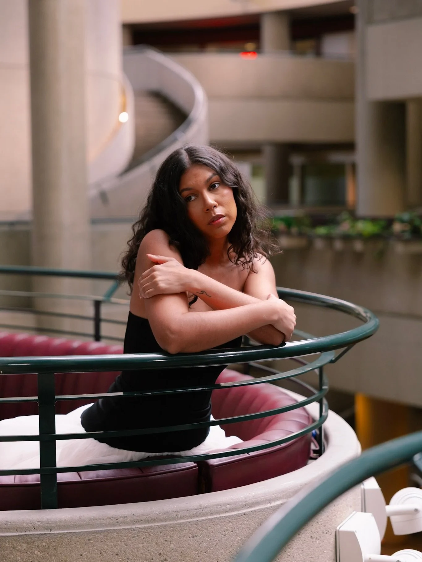 The vision going into this portrait photoshoot was to create something simple yet high fashion enough for it to complement the rich reds of this location. The lighting ended up being dim but it created a slightly moody and dramatic scene that was fit