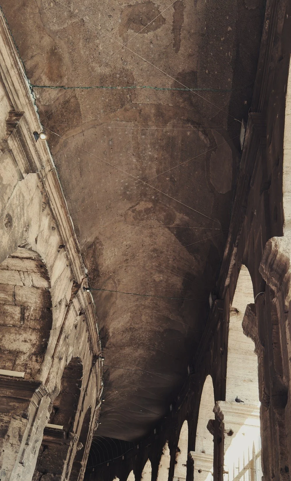 The ceiling and arches inside the Colosseum, Rome