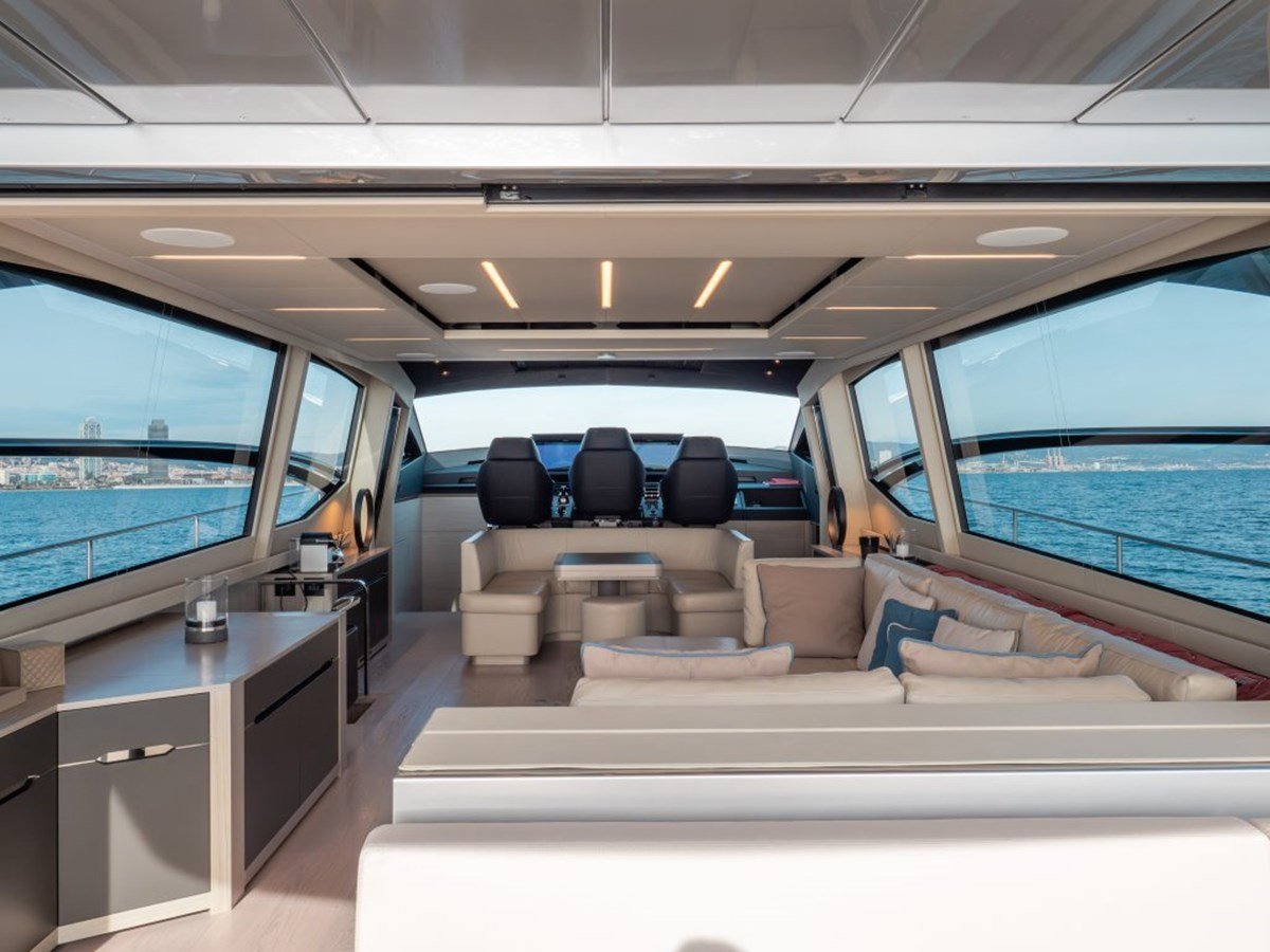 Luxurious salon of the Pershing 8X with contemporary furnishings and panoramic windows.