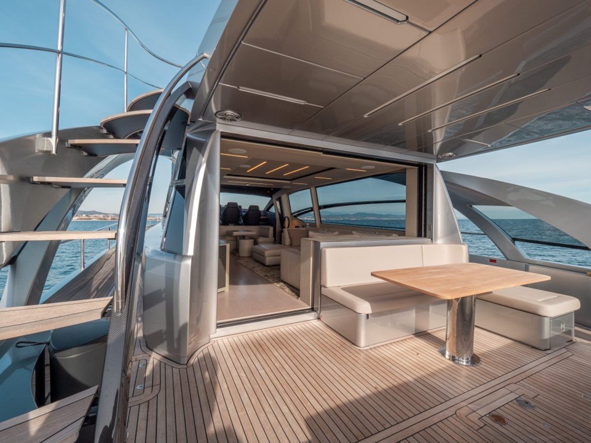 Spacious aft deck of the Pershing 8X featuring comfortable seating and dining areas for outdoor entertainment.