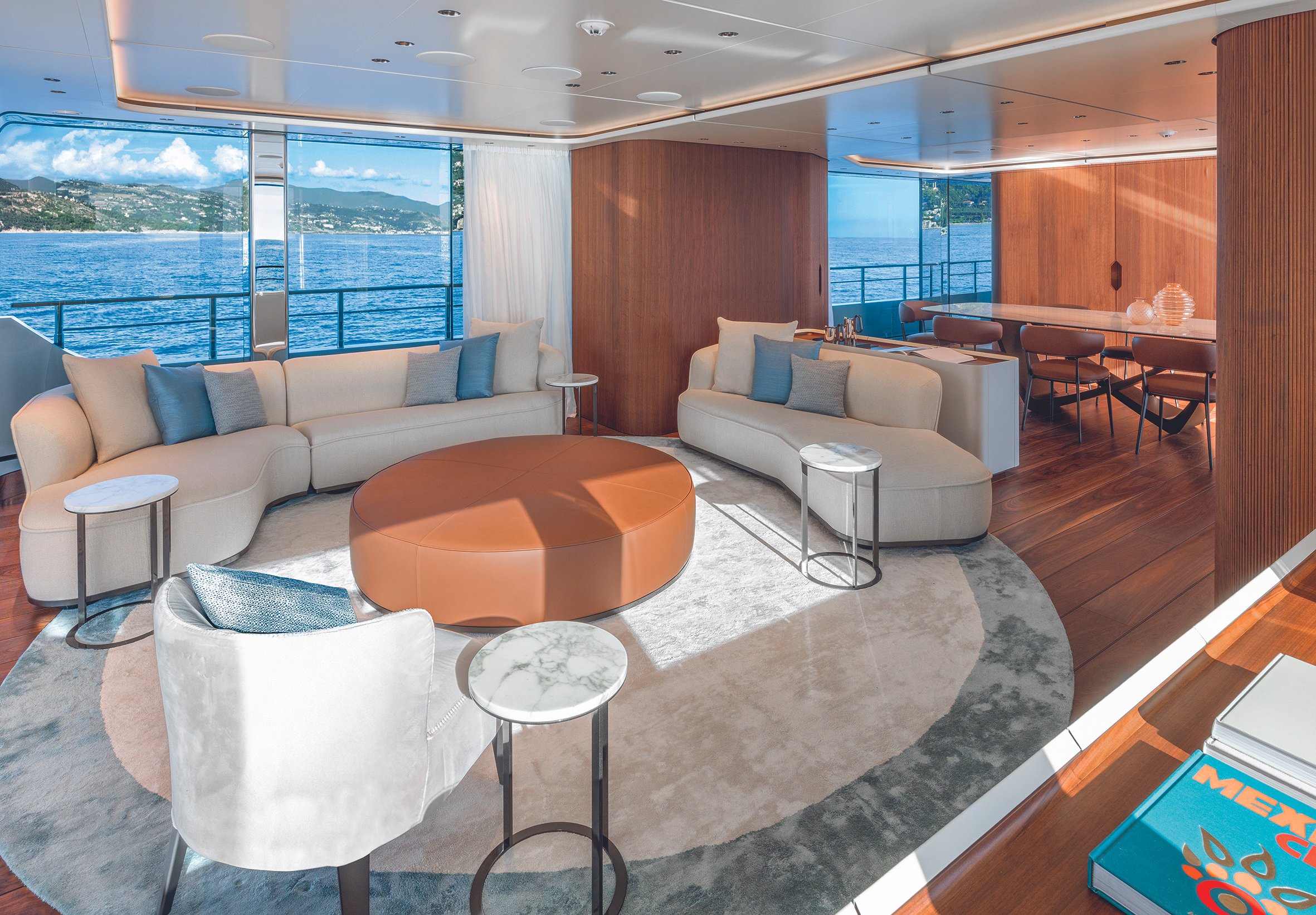 Main Salon Sophistication: Step into the main deck salon — a blend of open-plan living, formal dining, and panoramic windows that connect sea and space.