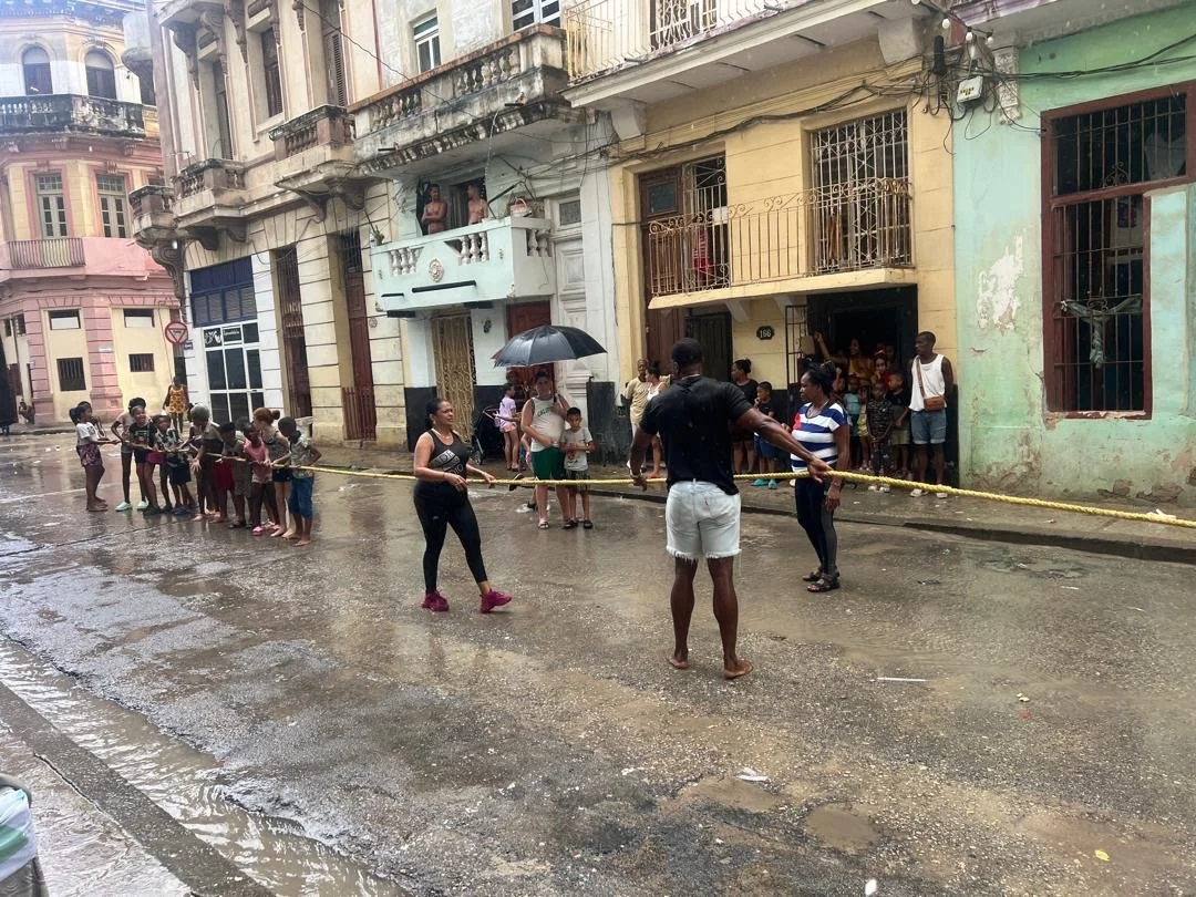 2008 Olympic hurdles champion Dayron Robles is mobbed by children at the Cuban National Athletics Stadium in Havana