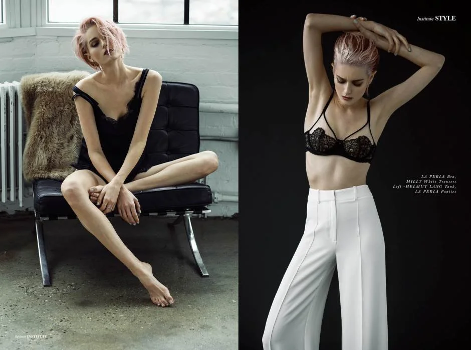 Side-by-side comparison of a woman in two fashion photos. On the left, the woman with short pink hair, wearing a black lace camisole, sitting on a black chair in a bright, industrial-style room with a white brick wall and large window. On the right, the same woman with pink hair styled back, wearing a black lace bra and high-waisted white trousers, against a black background, with her arms raised above her head.