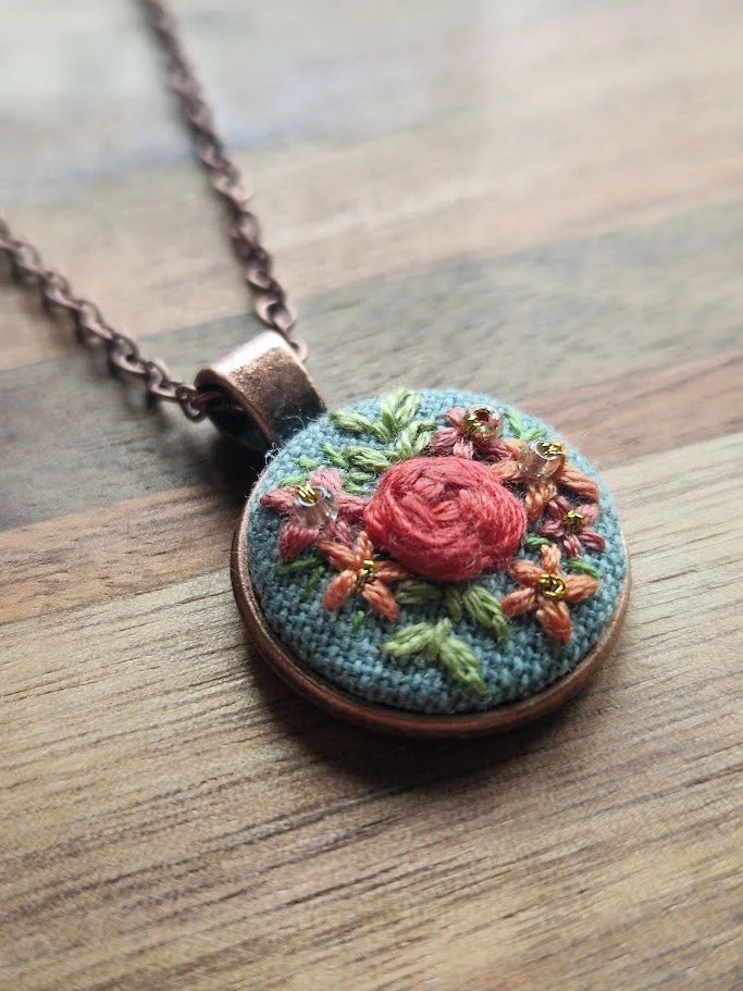 Floral Elegance Hand-Embroidered Copper Pendant
