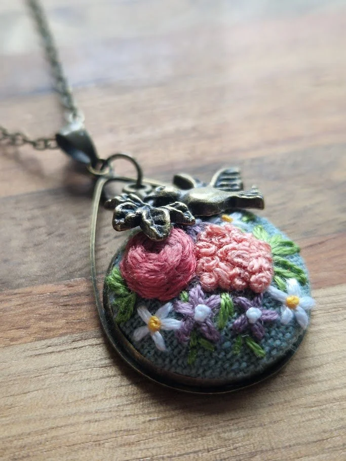 Floral Elegance Embroidered Pendant with Dove Charm