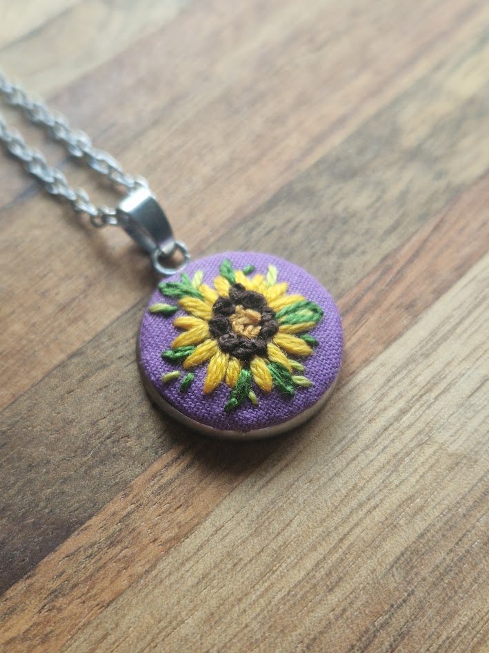 Sunflower Embroidery Pendant on Purple Cotton