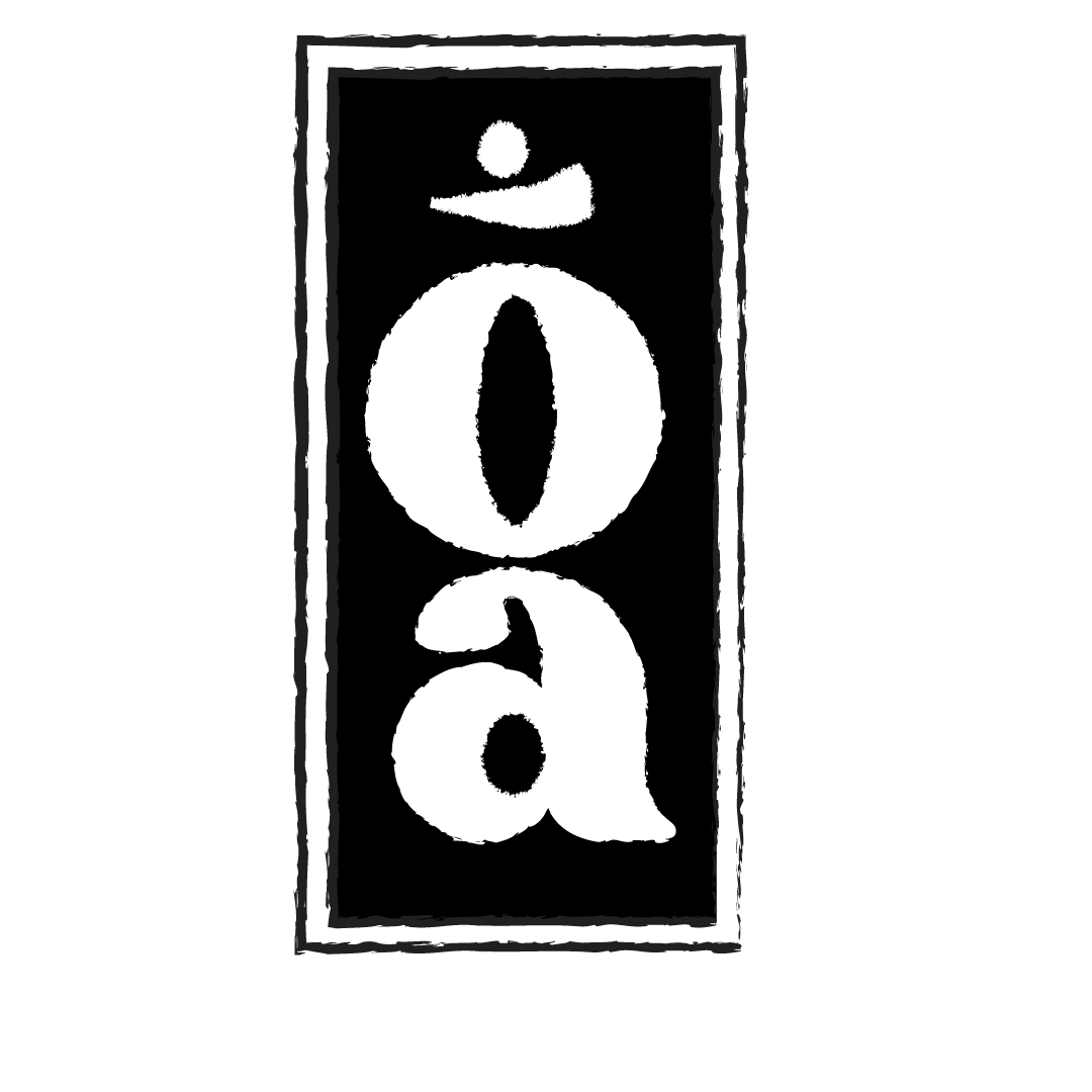 Black sign with the word 'idea' written vertically in white, stylized letters.