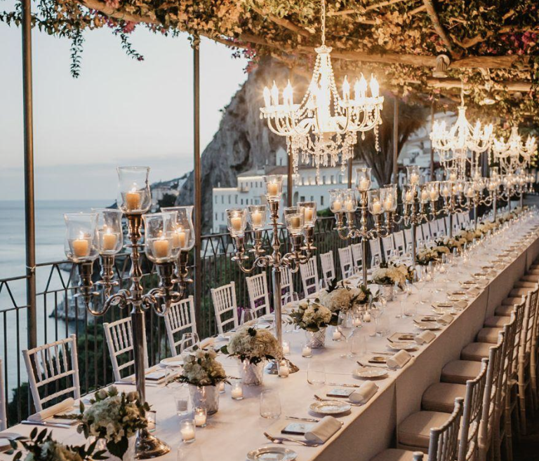 Luxury Amalfi Coast wedding reception overlooking the sea with elegant table setup