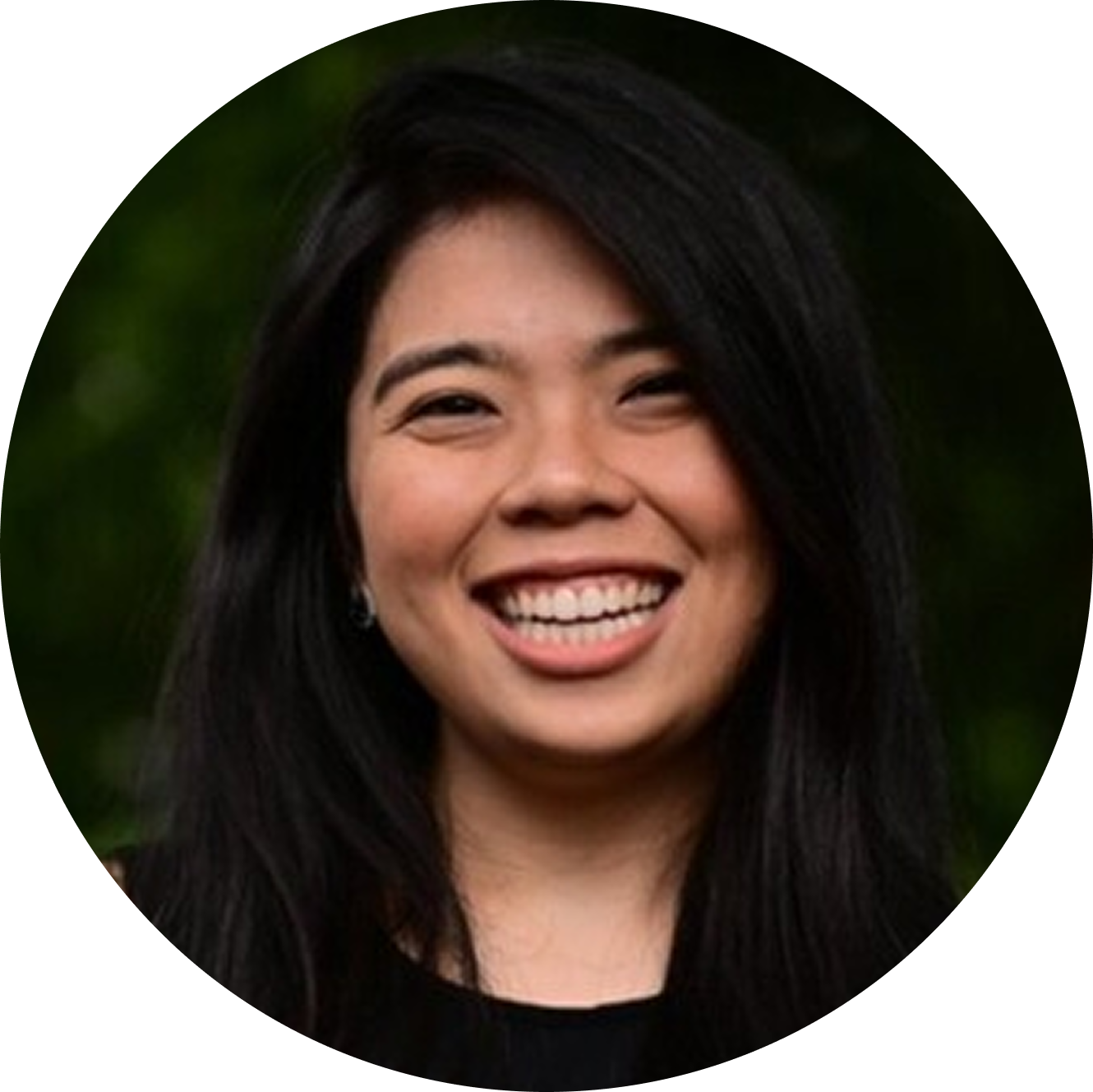 Smiling person with long dark hair