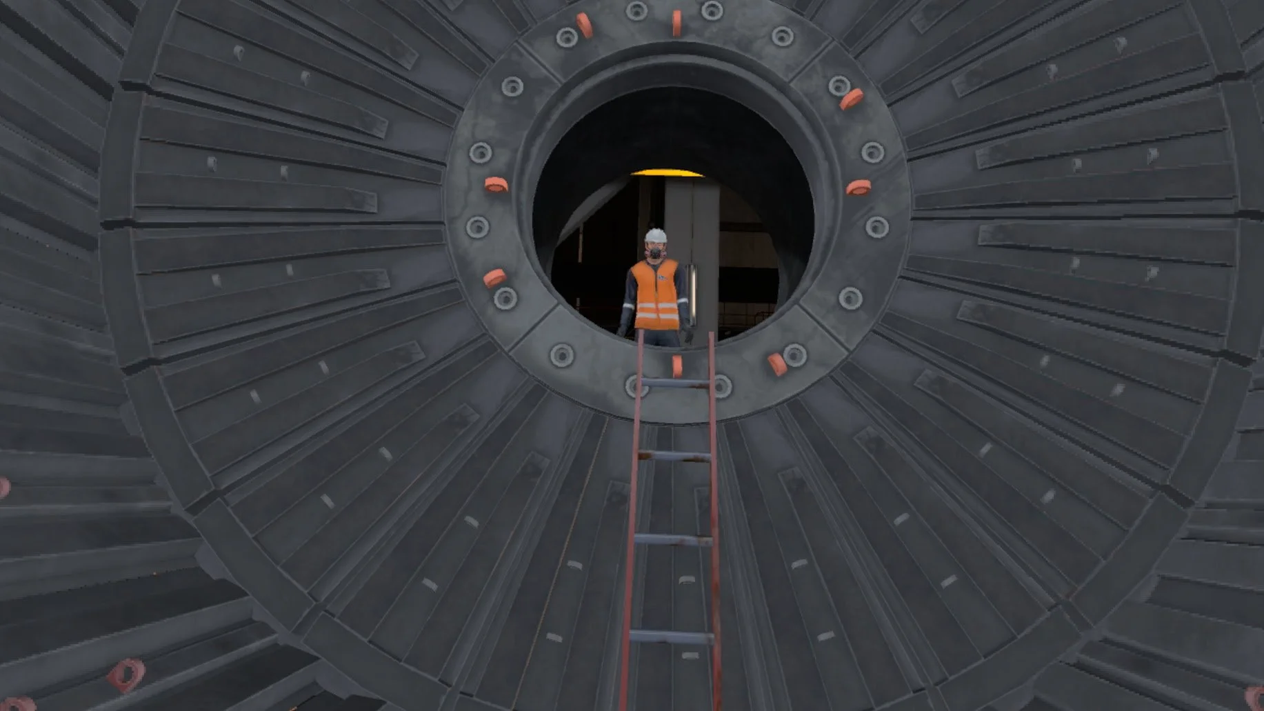 Construction worker in safety gear standing inside a large industrial metal structure with a ladder.