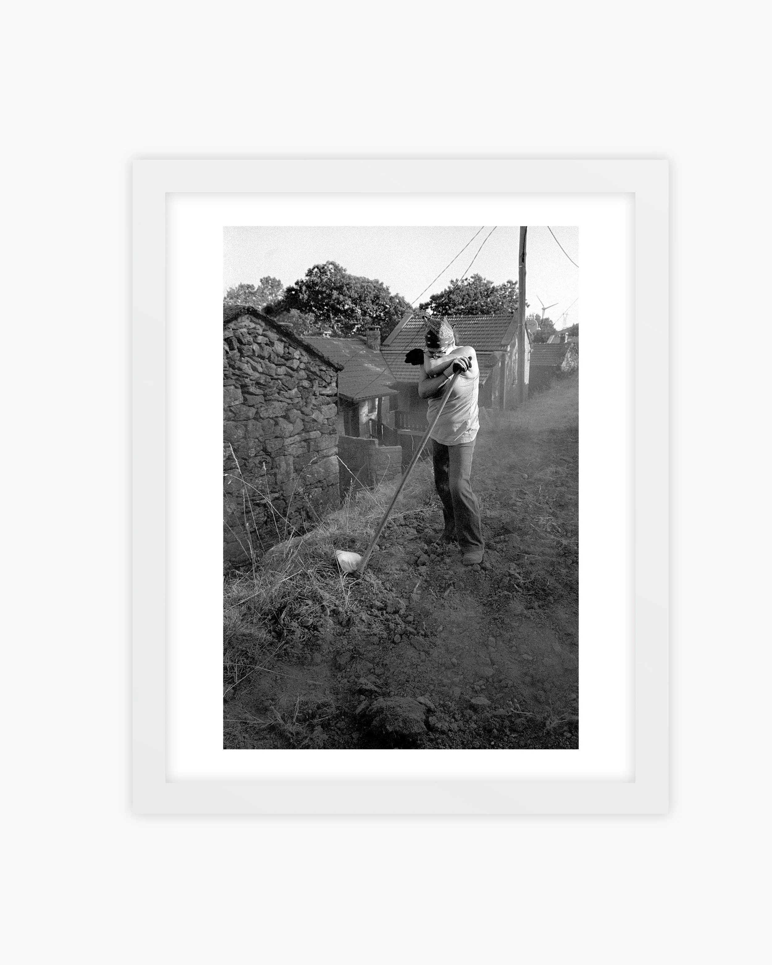 04. A woman with a hoe after working the land. Mourim, Portugal. 2025..jpg