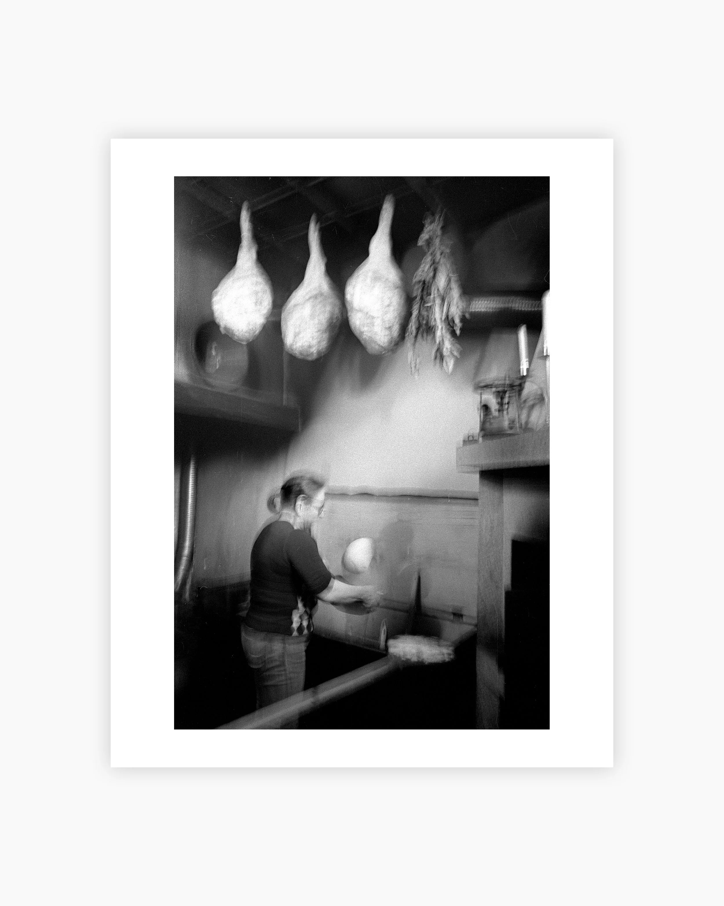A woman making a traditional corn bread. Viana do Castelo, Portugal. 2025.