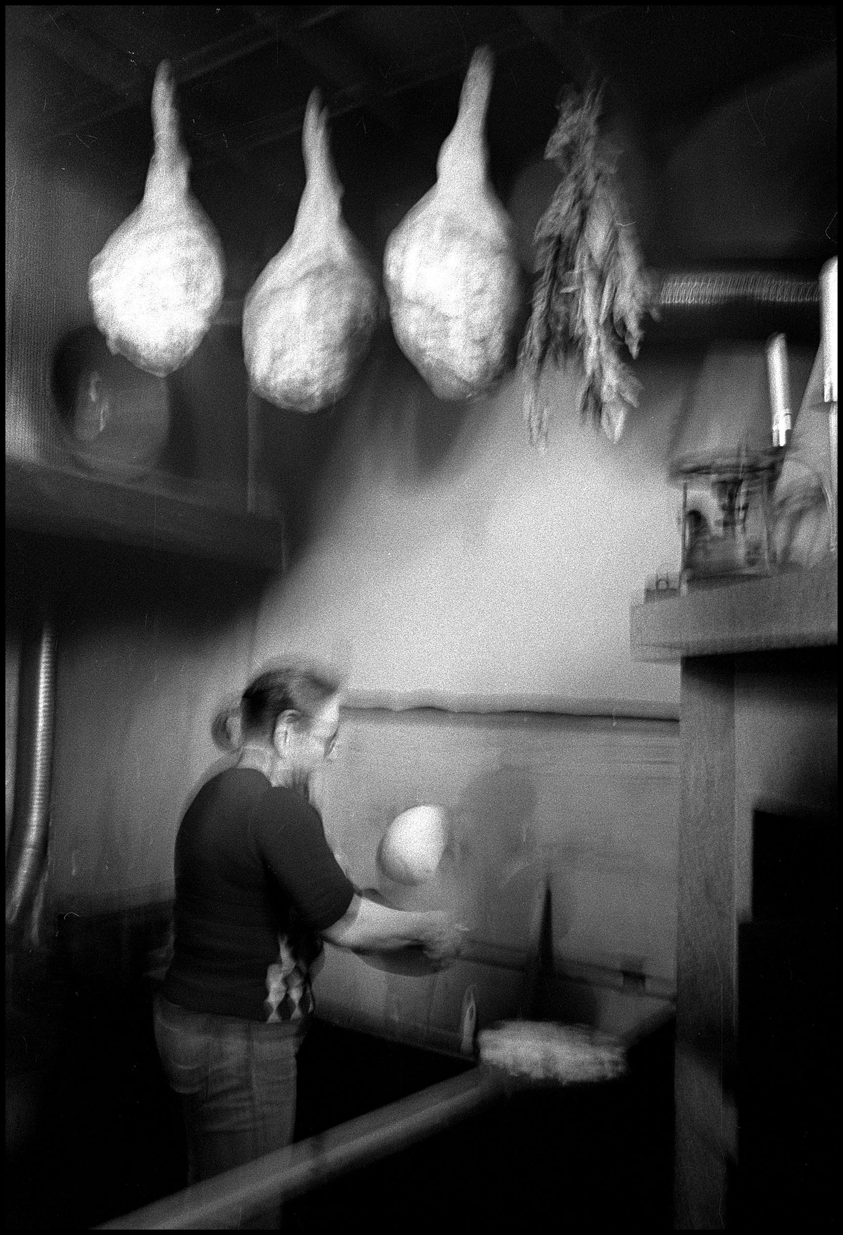 A woman making a traditional corn bread. Viana do Castelo, Portugal. 2025.