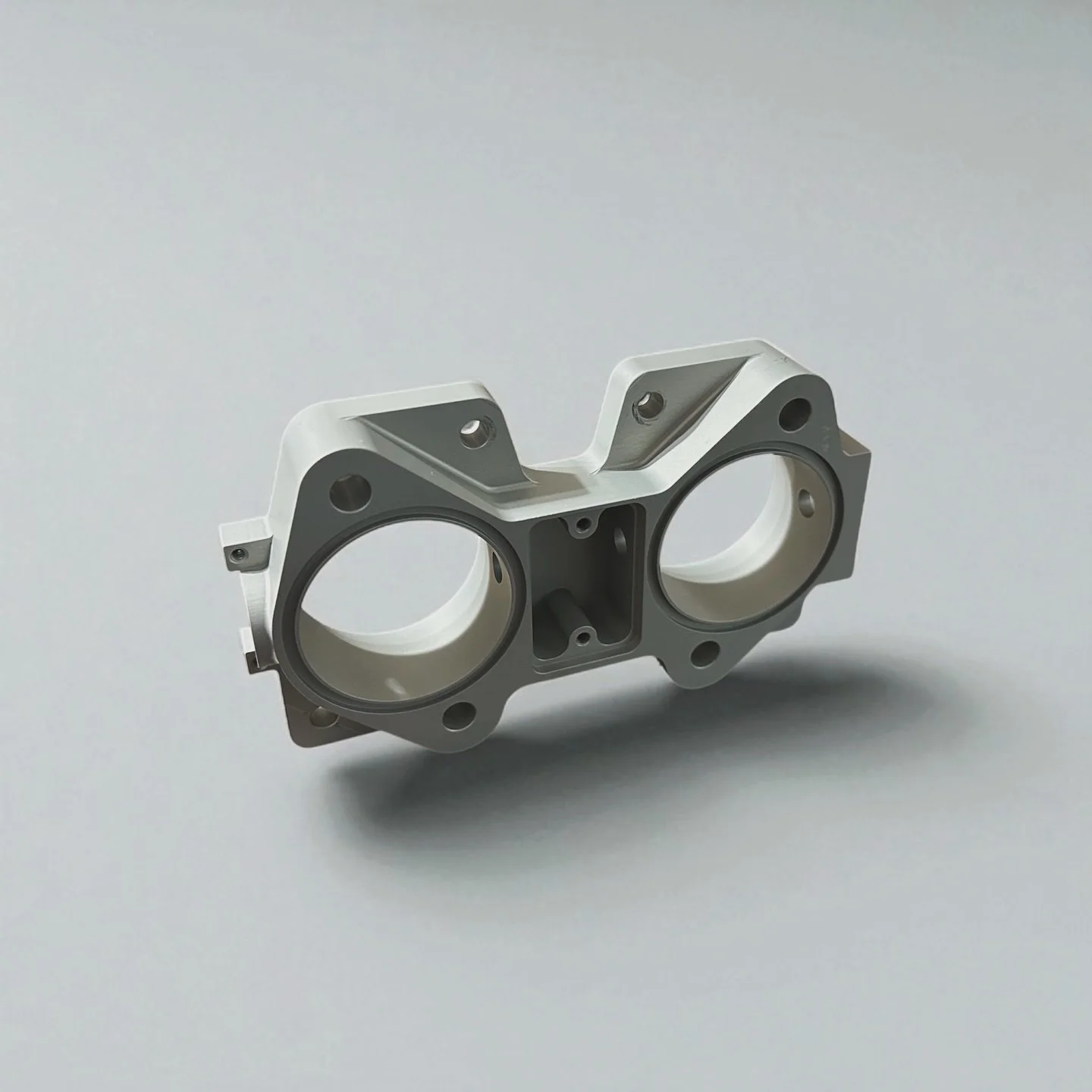 Throttle Body designed around the idea of being able to utilize off the shelf Weber 50mm DCOE hardware to help lower overall production cost. Space was limited on the application which drove the 1&rdquo; thick throttle body design. These were manufac