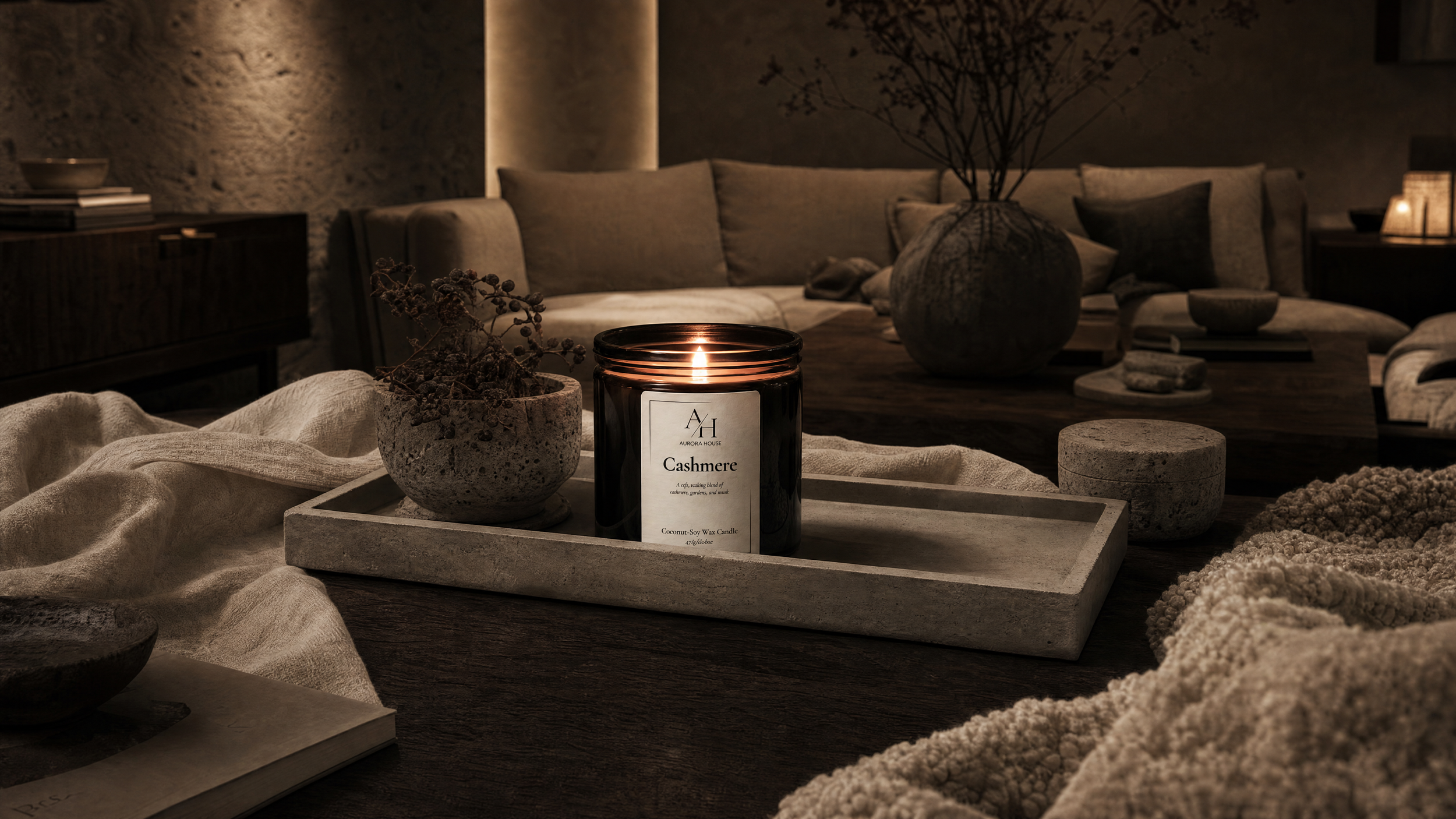 Aurora House Cashmere 15oz Candle styled on Linea concrete tray in cozy warm neutral living room