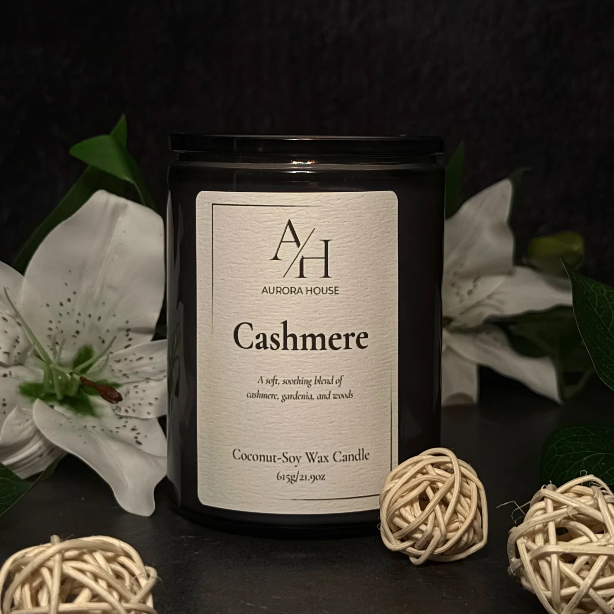 Aurora House 12oz Candle Cashmere with white lilies and cozy wicker balls