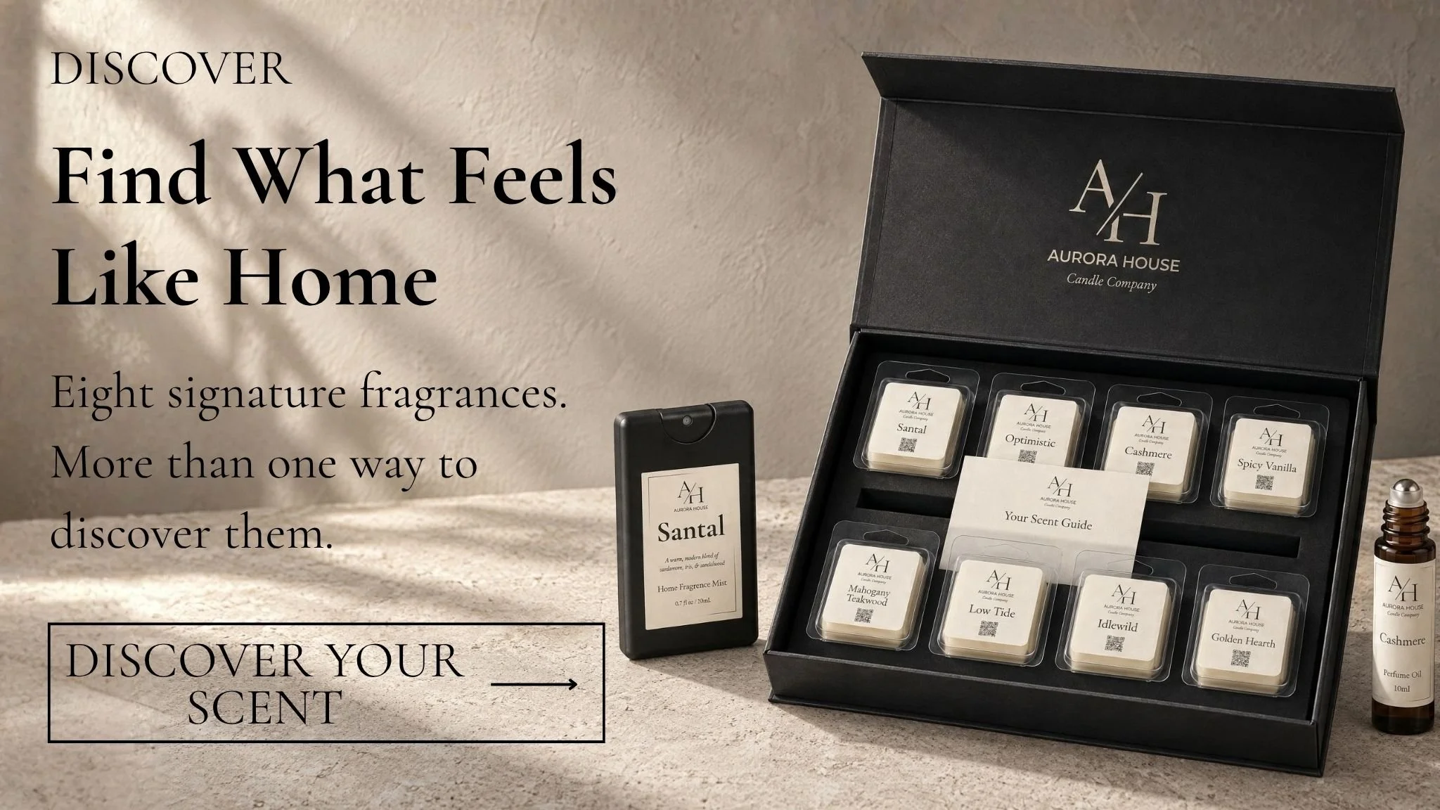 Aurora House fragrance discovery collection featuring eight signature wax melt samples, a mini home fragrance mist, and a perfume roller displayed beside a black discovery box.