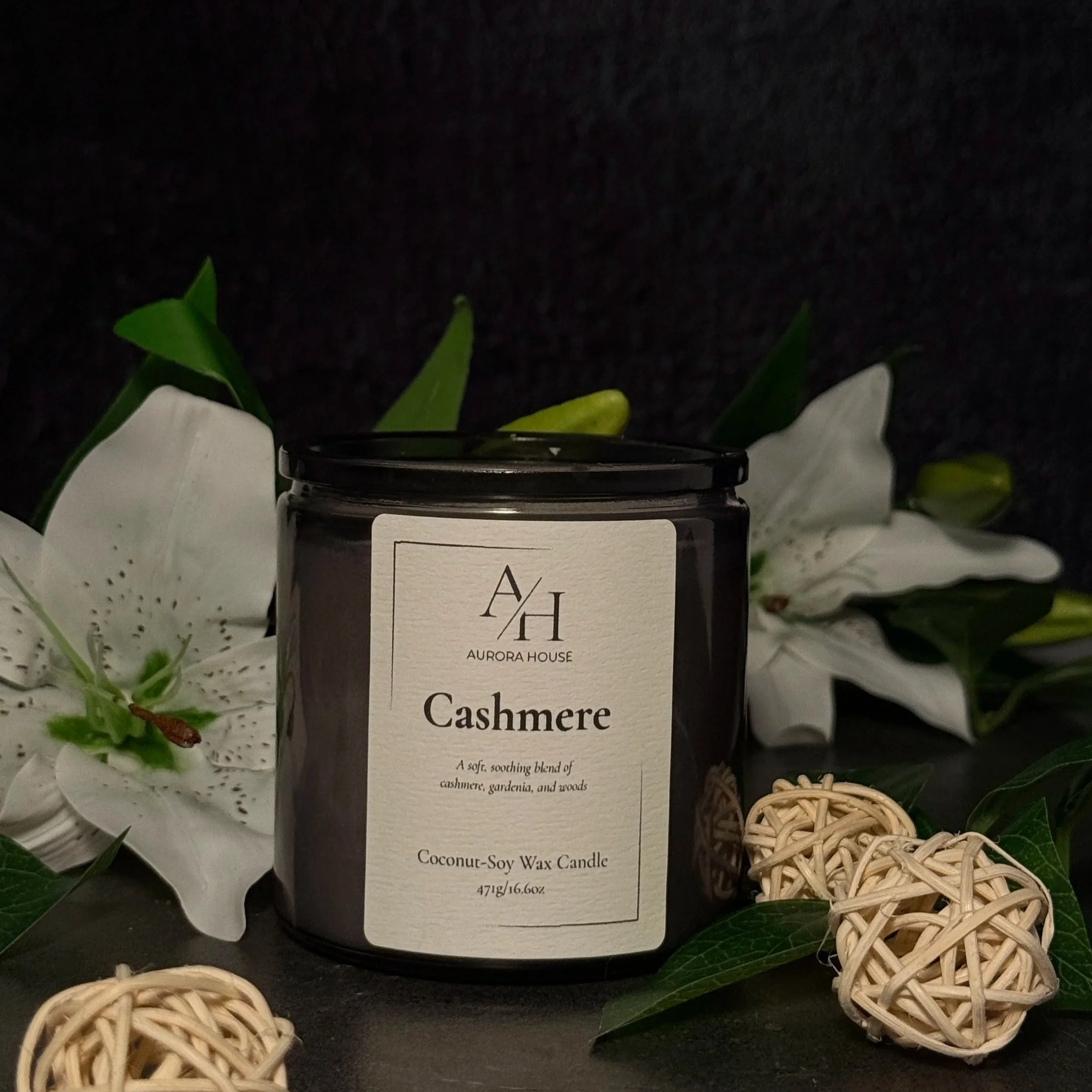 Aurora House 9oz candle Cashmere with white lilies and cozy wicker balls