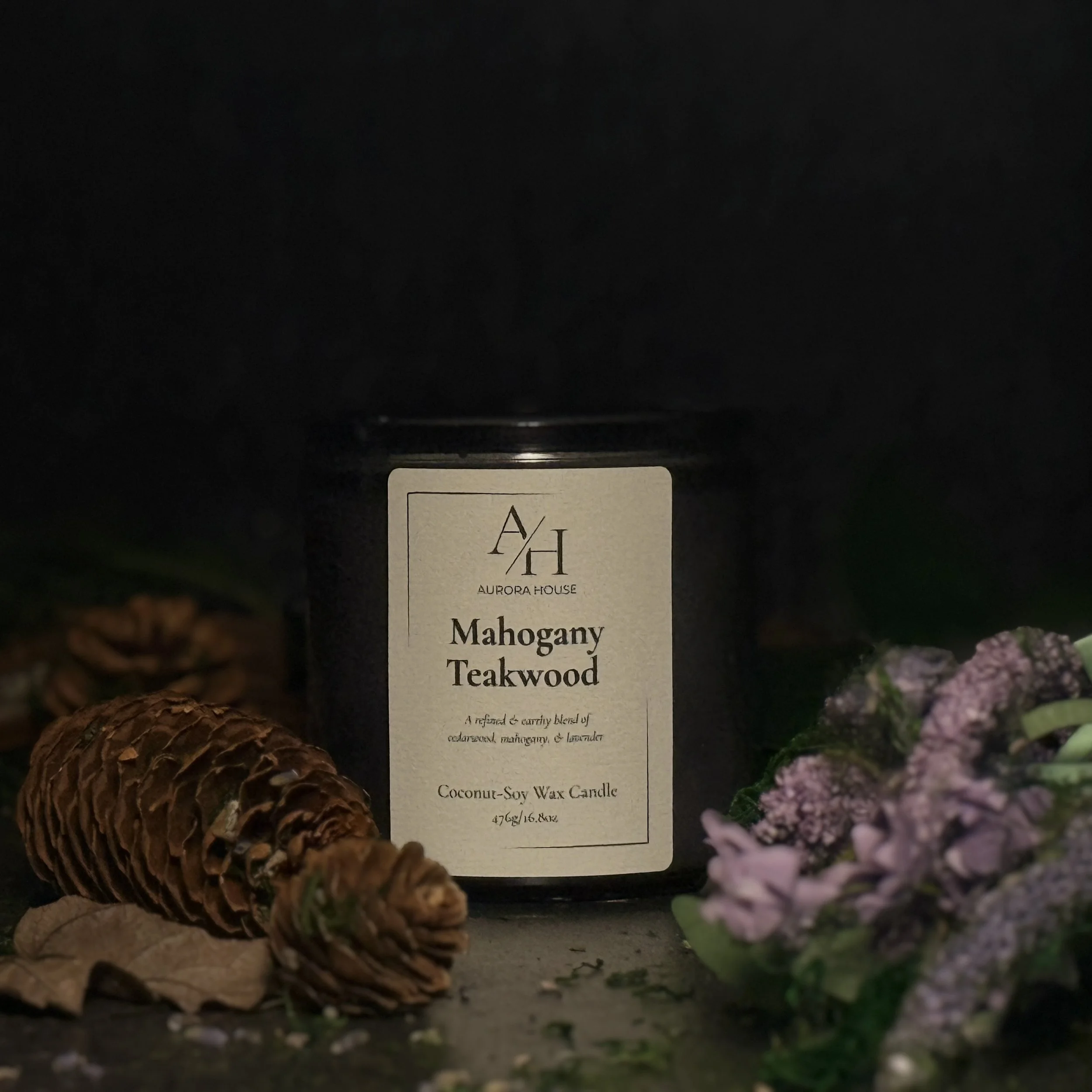 Aurora House 9oz candle MahoganyTeakwood with earthy accents and lavender sprigs