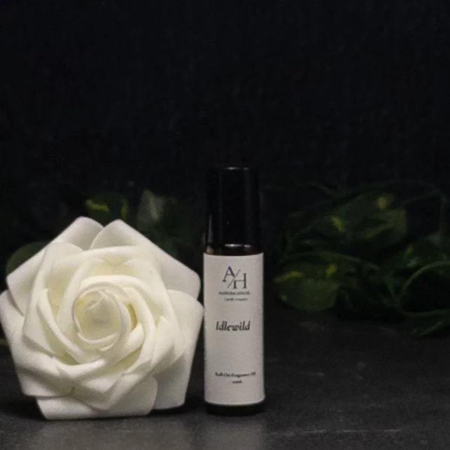 Aurora House Fragrance Oil Roller Idlewild with white roses and green ivy