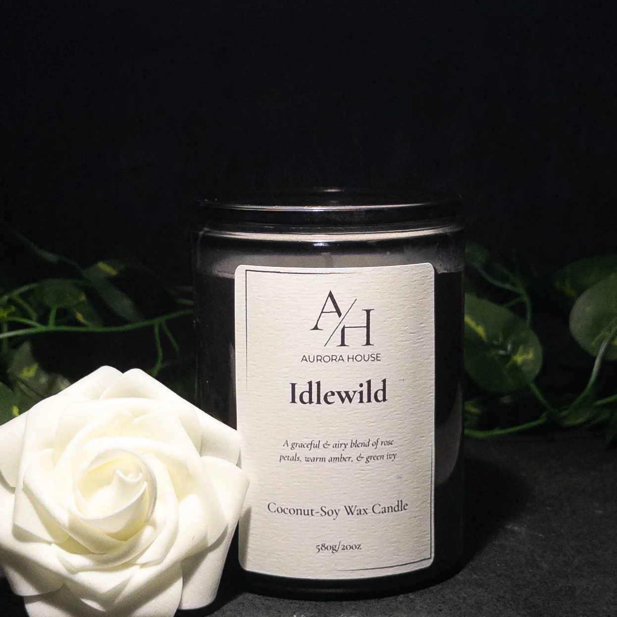 Aurora House 12oz candle Idlewild with white roses and green ivy