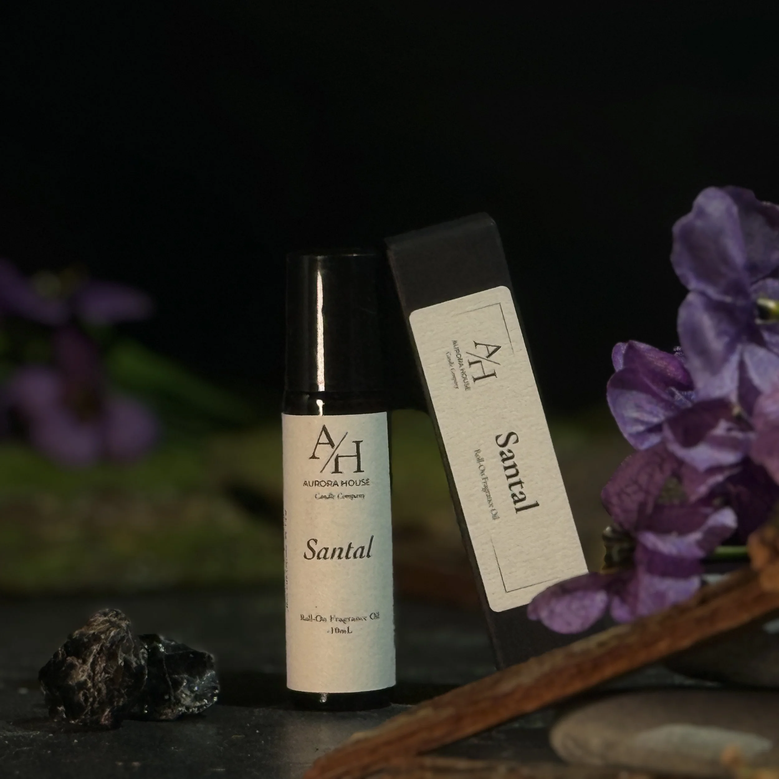 Aurora House Fragrance Oil Roller Santal with earthy accents and violet sprigs
