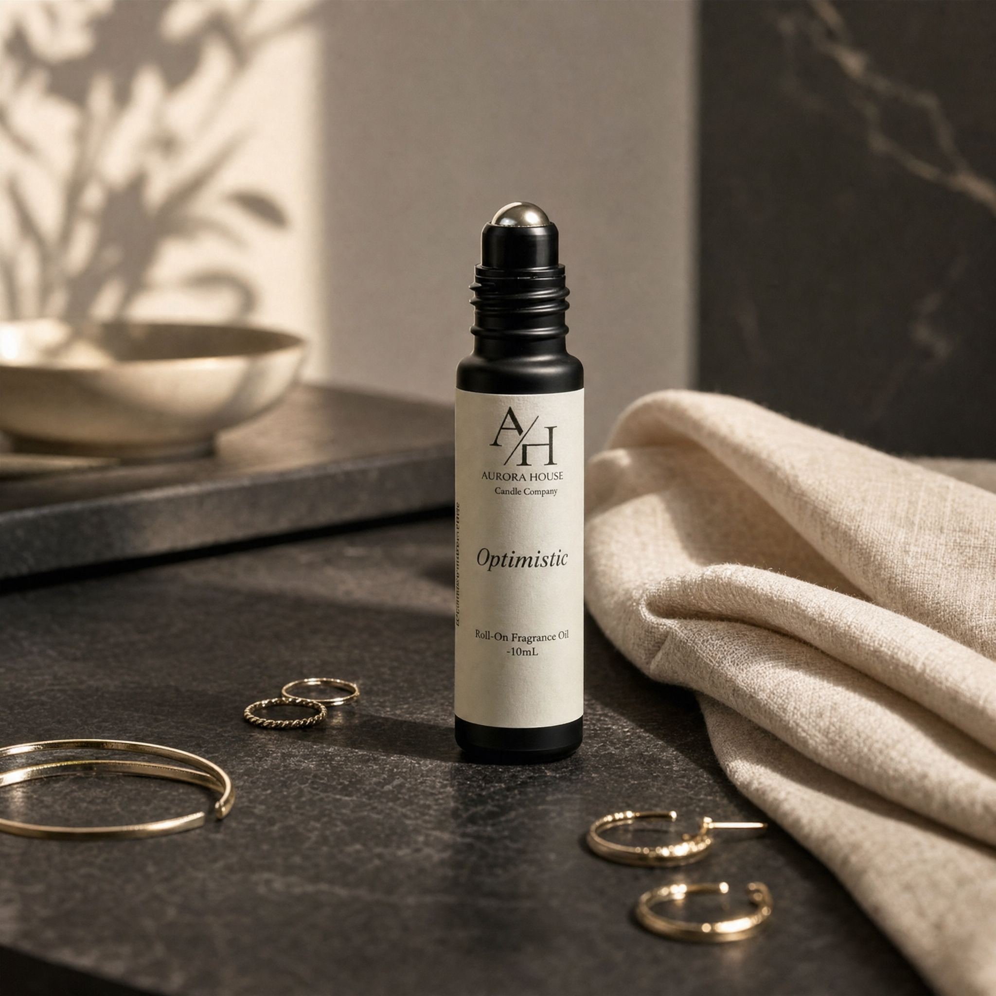 Aurora House 10 mL fragrance roller with minimalist luxury styling.
