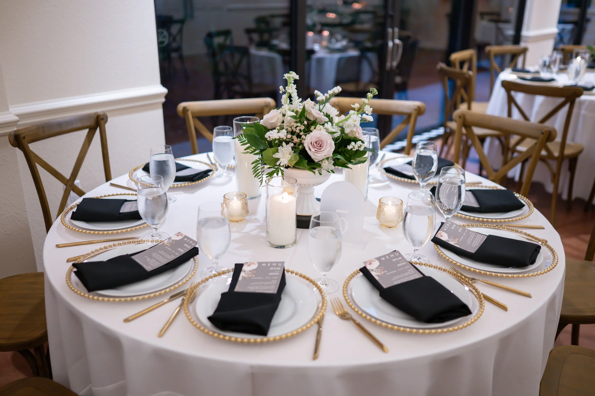 Guest tables with black napkins and ivory accents.jpg