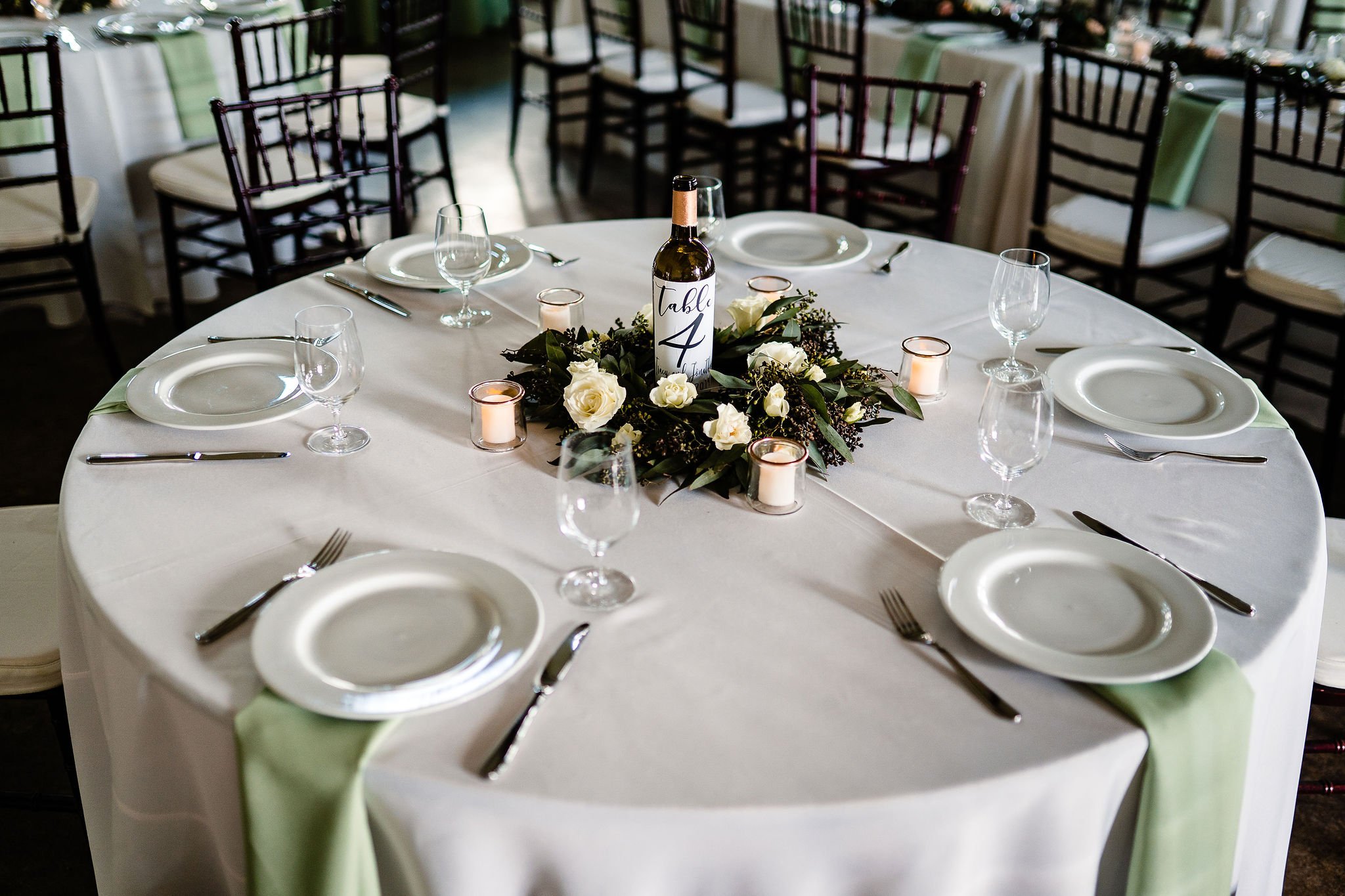 Guest table with Wine Bottle Table number.JPG