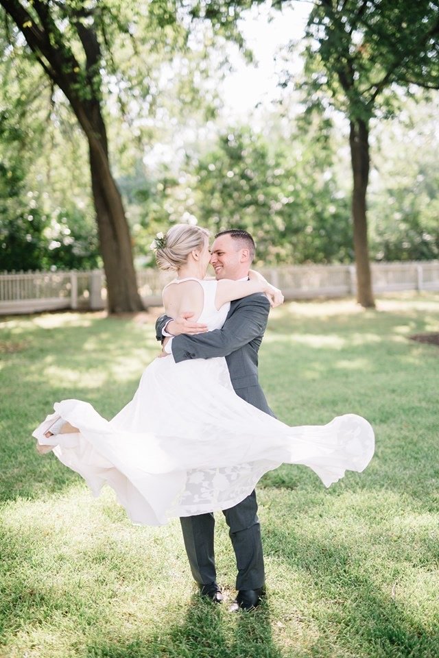 Couple spinning in the field at Woodbine Mansion in Round Rock Texas