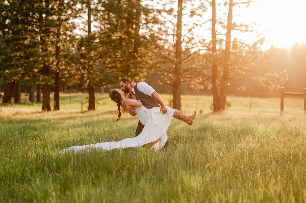Bride and Groom Dip in the field at a wedding in Northern california