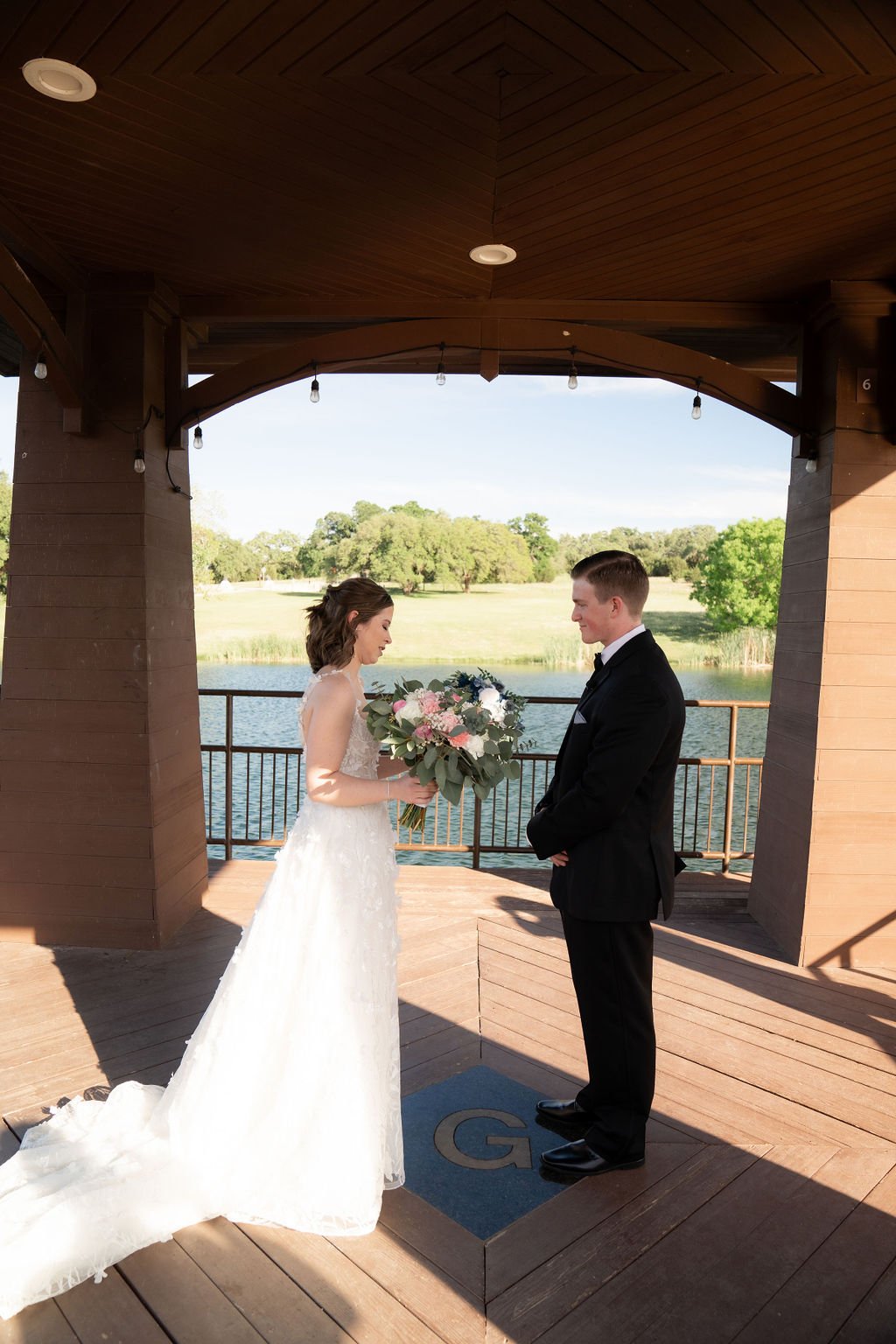 Bride and Groom doing private vows on the dock at The Garey House in Georgetown Texas