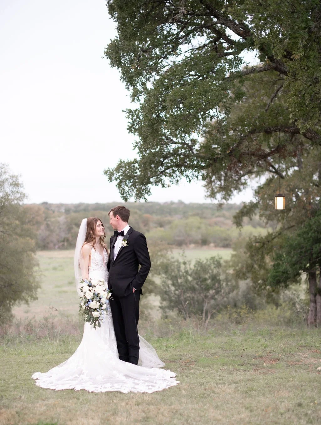 Bride and Groom in the field at HighPointe Estates in Georgetown Texas