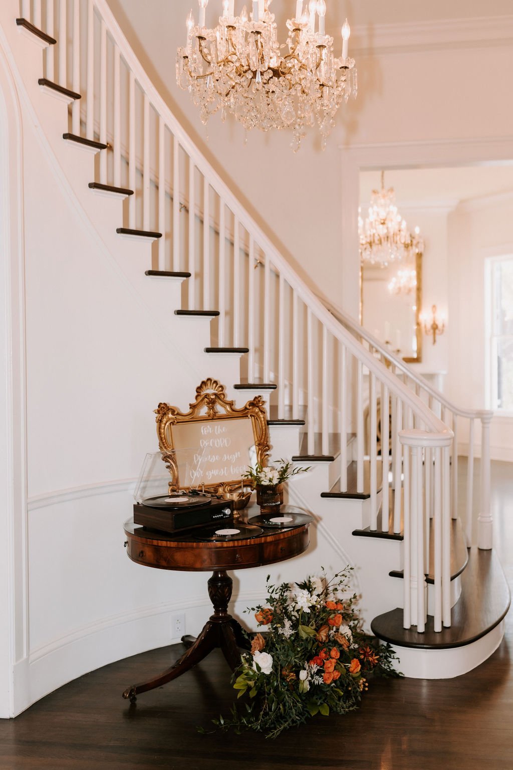 For the Record sign in book with a Record player at the bottom of the stairs at Woodbine Mansion in Round Rock Texas