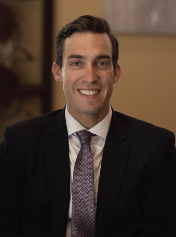 Man in formal attire smiling