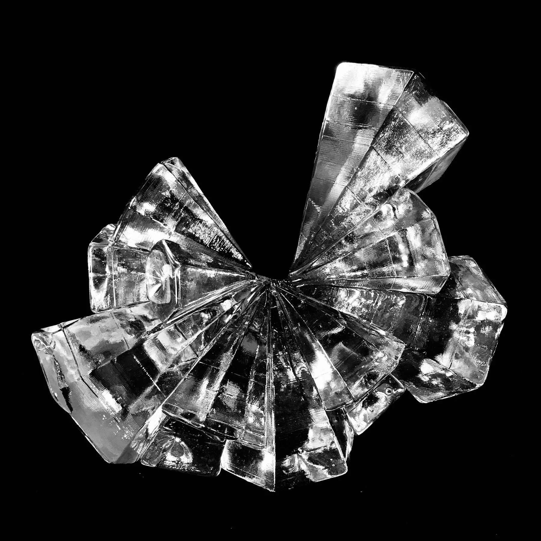 Apsara #3, 2018. Hot joined 5 and 6 sided cast glass cones, forming partial truncated icosahedron crystalline form. 15x16x9”