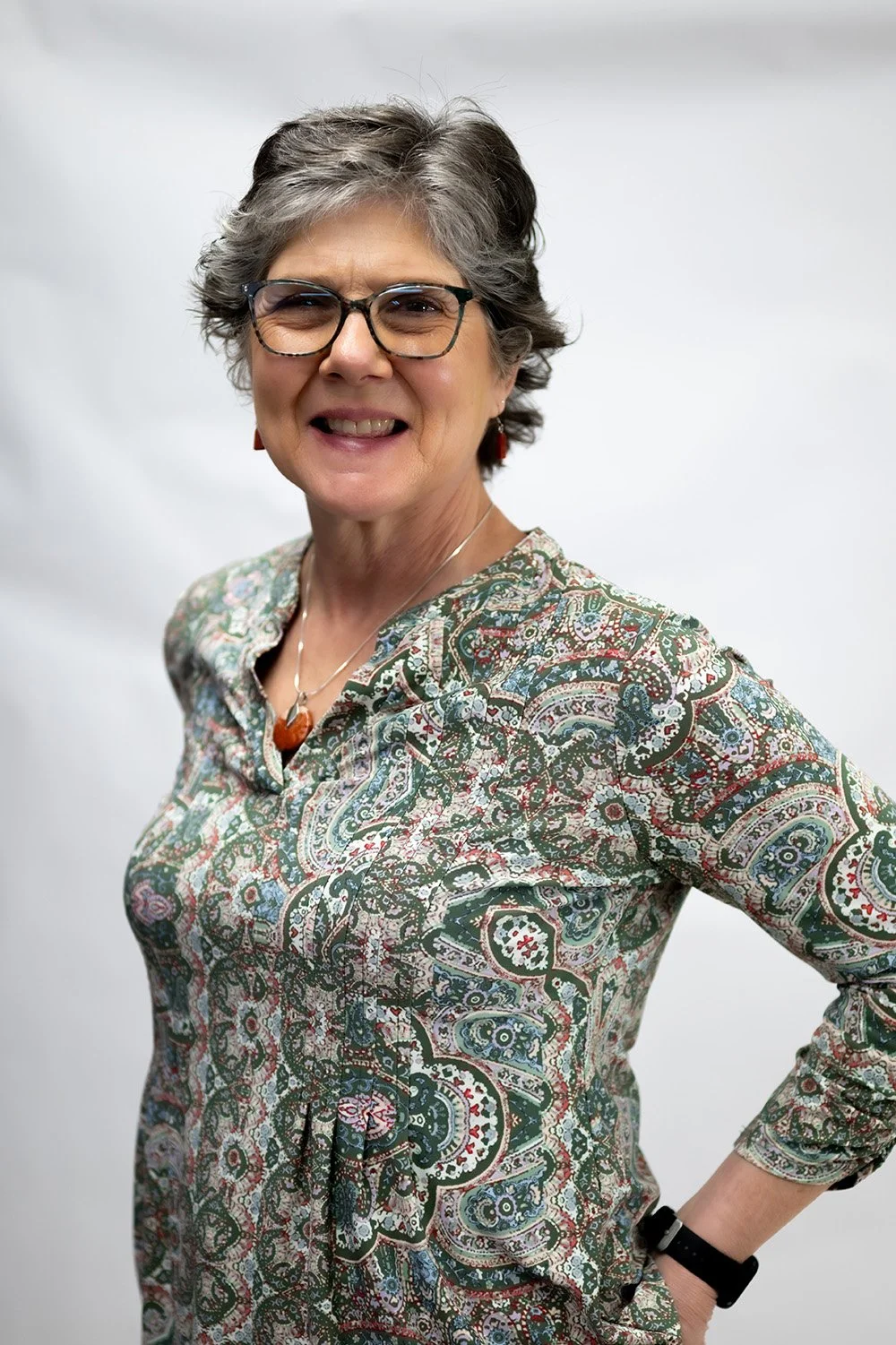Rural Nurse Writer Dance Plank in a paisley shirt smiling