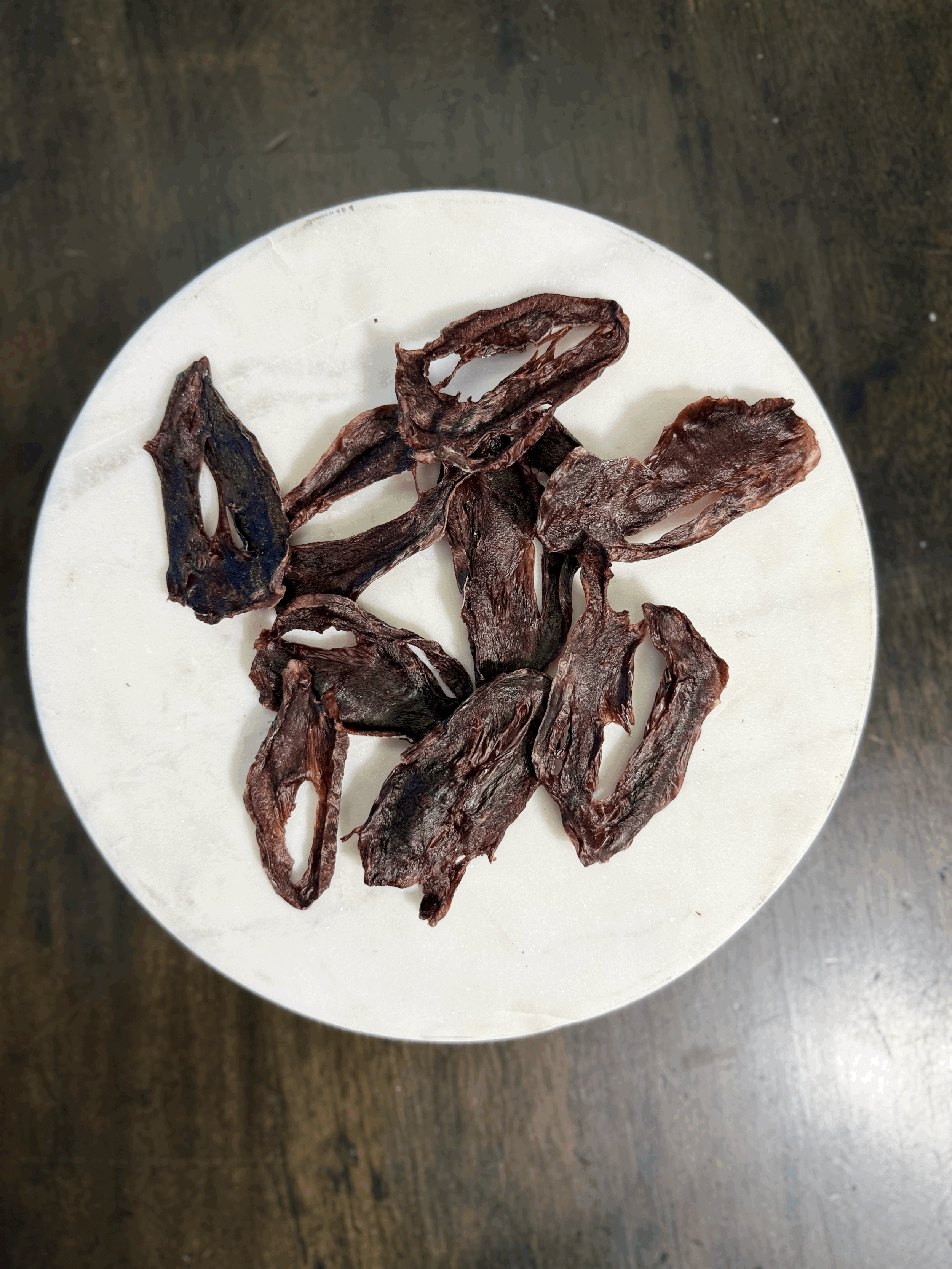 Close-up of goat heart dog treats in a 5 oz package.