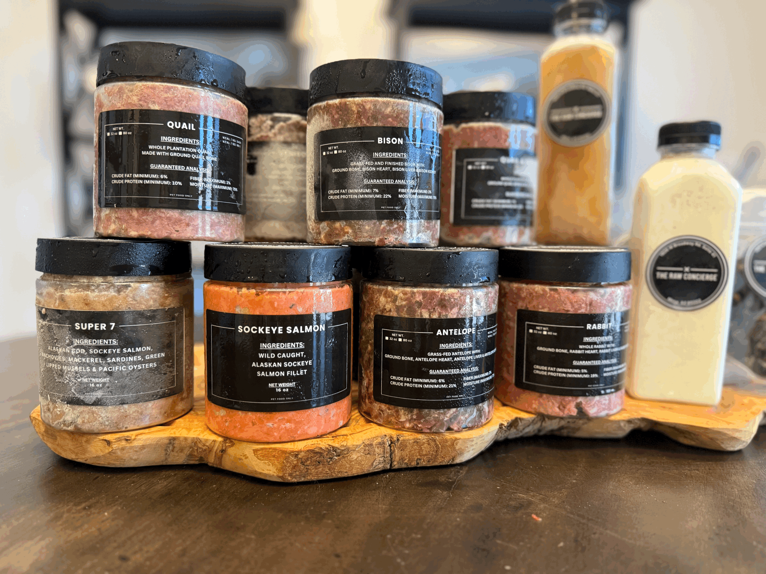 Assortment of goat’s milk, bone broth, and air-dried treats included in the Small Sampler Pack.