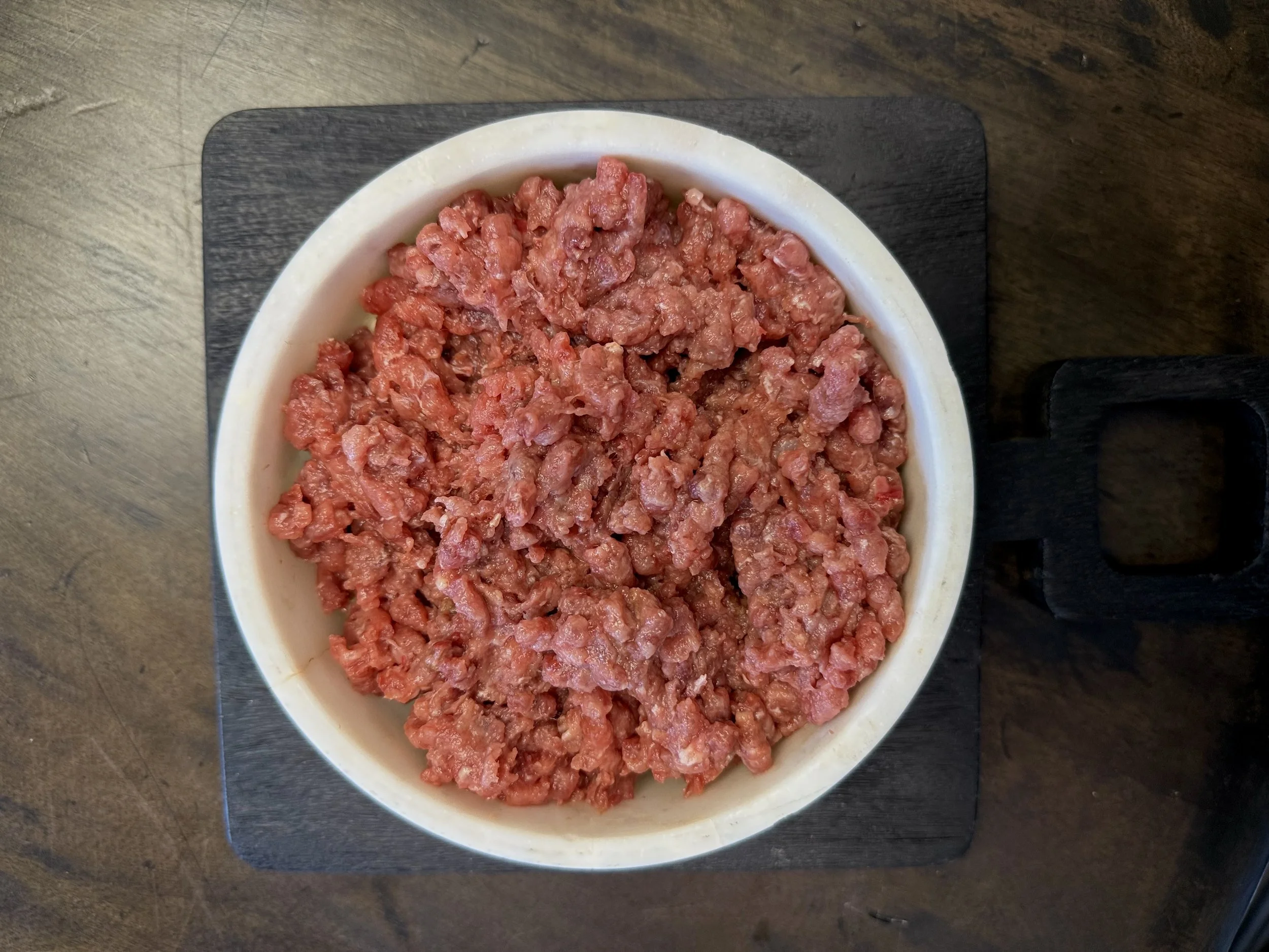 Raw boneless beef blend with added heart packaged frozen for dogs and cats, featuring single-protein grass-fed and finished beef with natural taurine support