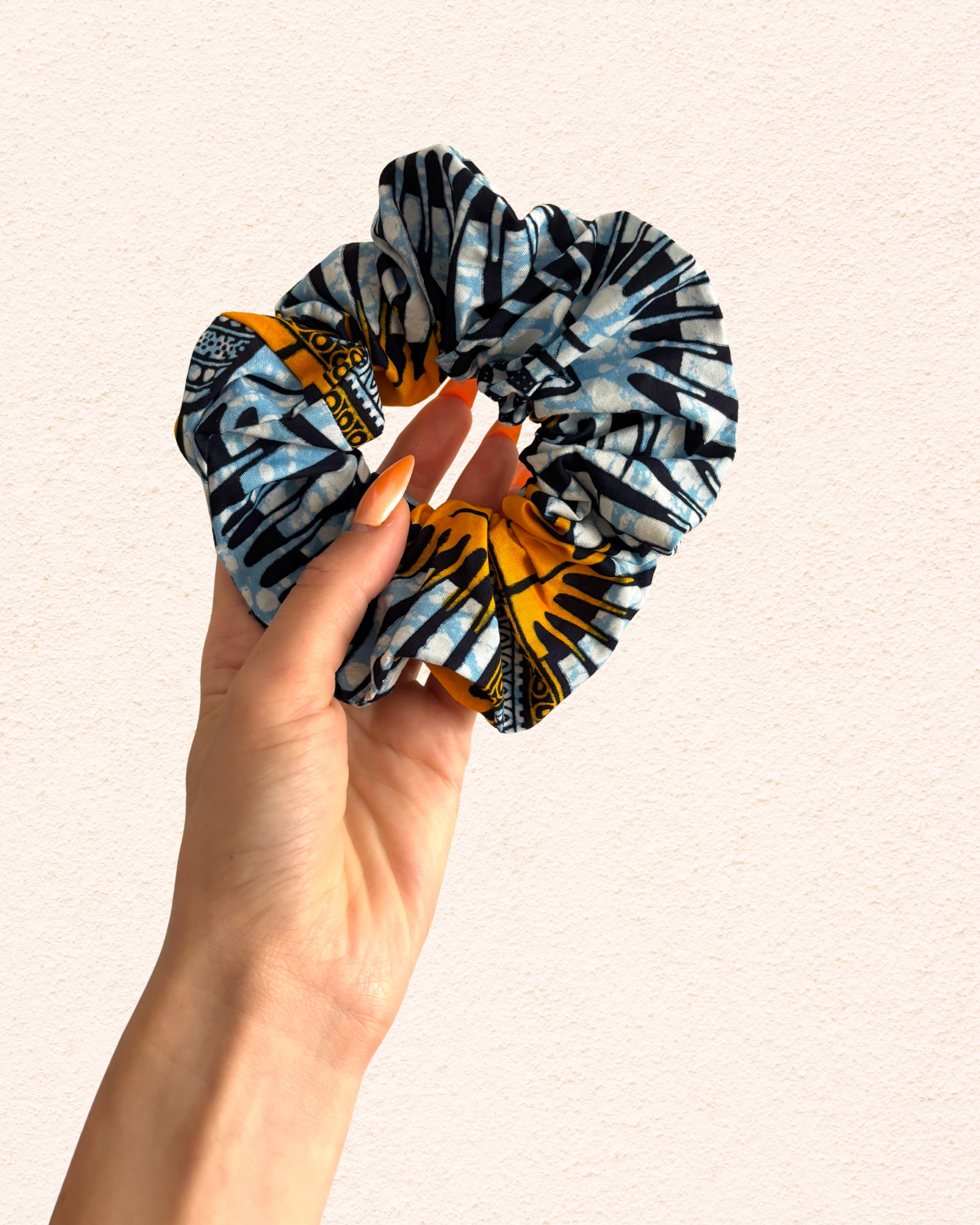Blue with yellow eyes Vlisco fabric.png