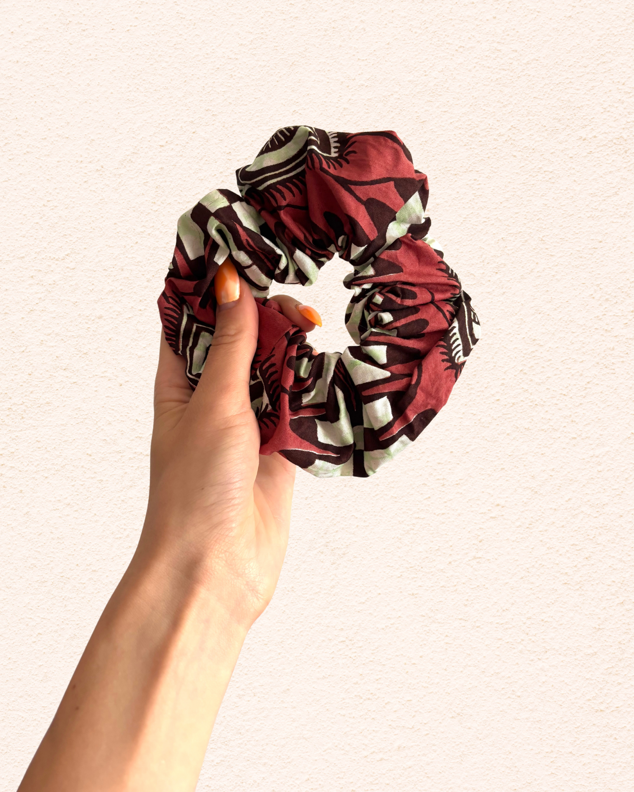 Dark red with eyes Vlisco fabric.png