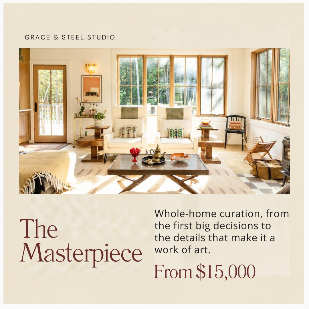 Interior of a living room with large windows, white armchairs, a wooden coffee table, and decorative items, promoting whole-home interior design services starting at $15,000.