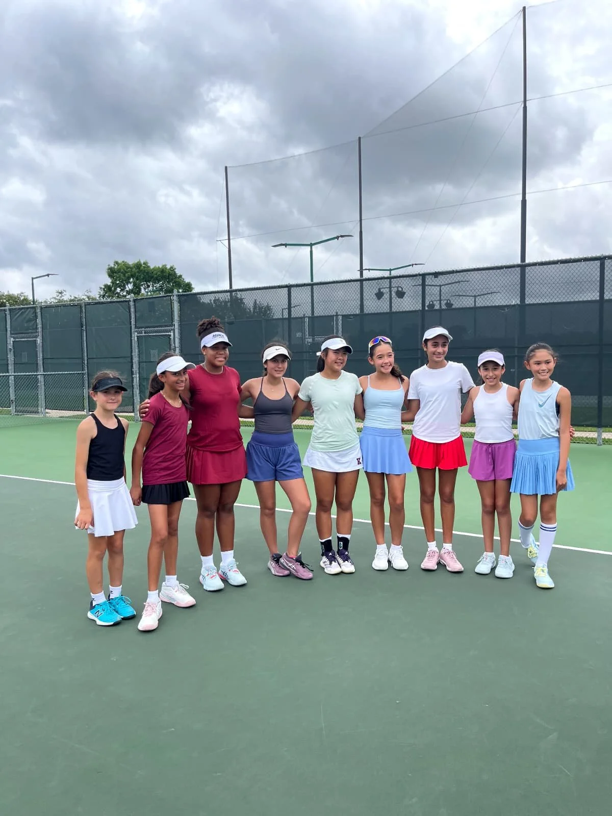 Monterrey and Houston youth tennis players together during the Monterrey Houston United Through Tennis dual meet