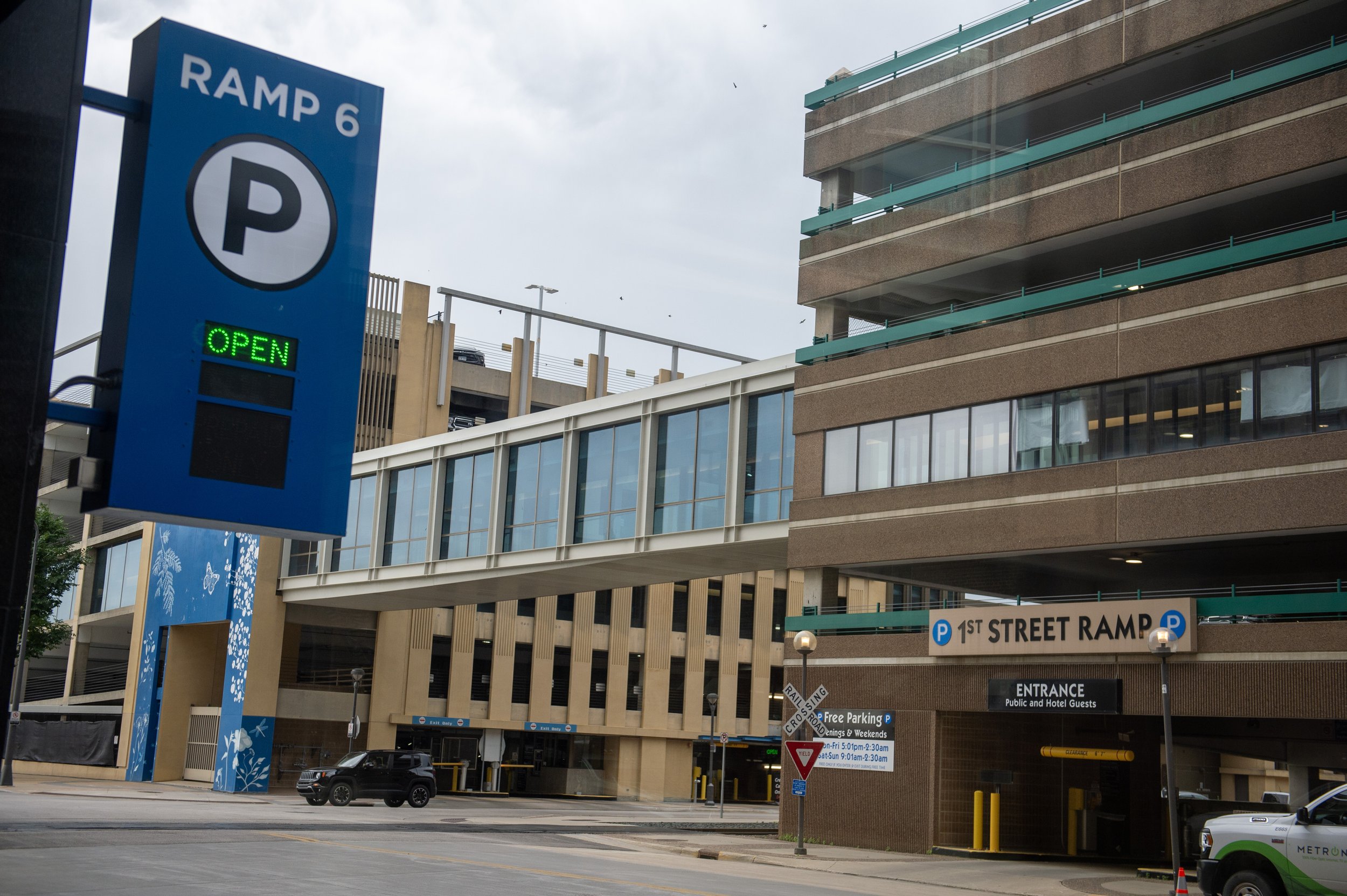 ramp 6 parking sign with the word 'open' displayed in green